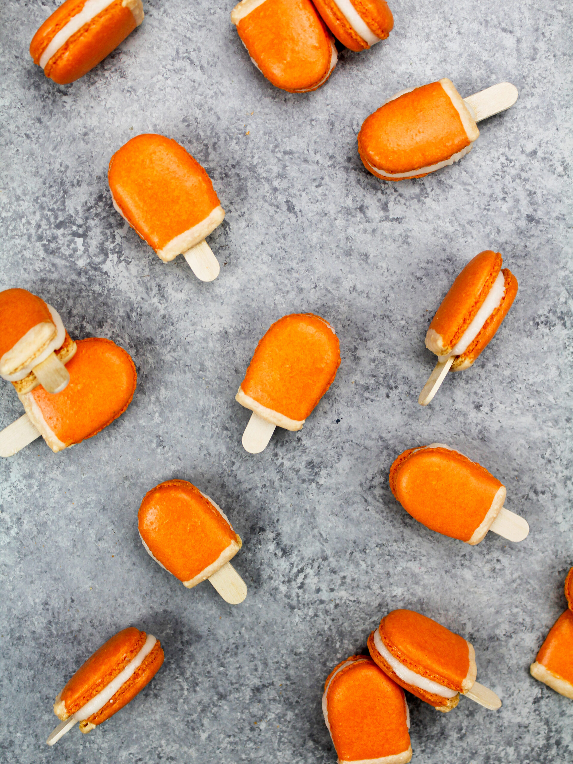 image of mini orange creamsicle macarons filled with orange creamsicle buttercream