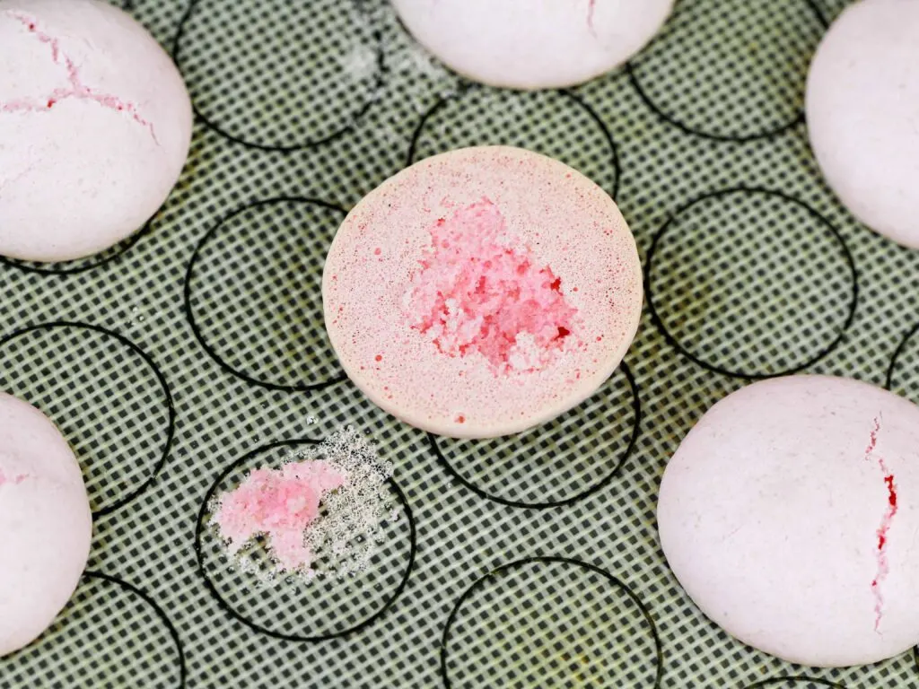 image of an Italian macaron that wasn't baked for long enough and stuck to the baking mat