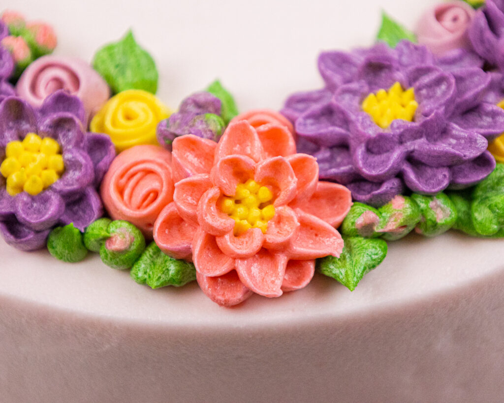 image of buttercream flower cake close up to show the beauty of the buttercream flowers