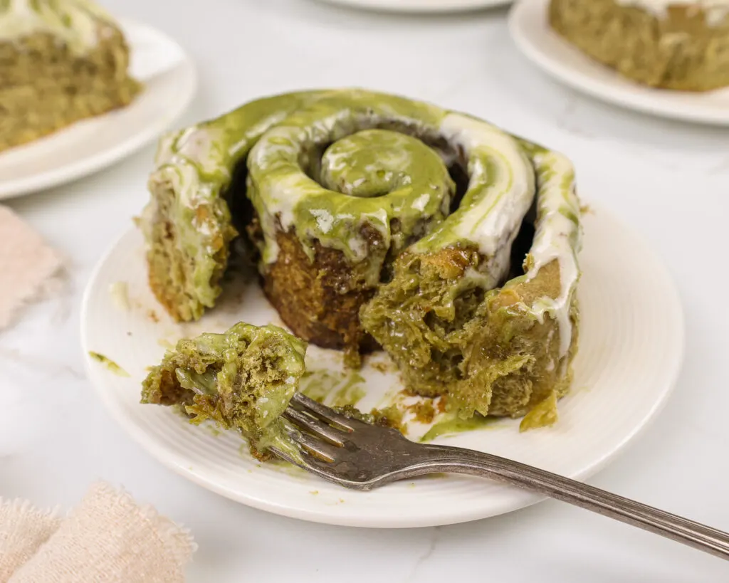 image of matcha cinnamon rolls that have been cut into to show how fluffy and soft they are