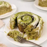 image of matcha cinnamon rolls that have been cut into to show how fluffy and soft they are
