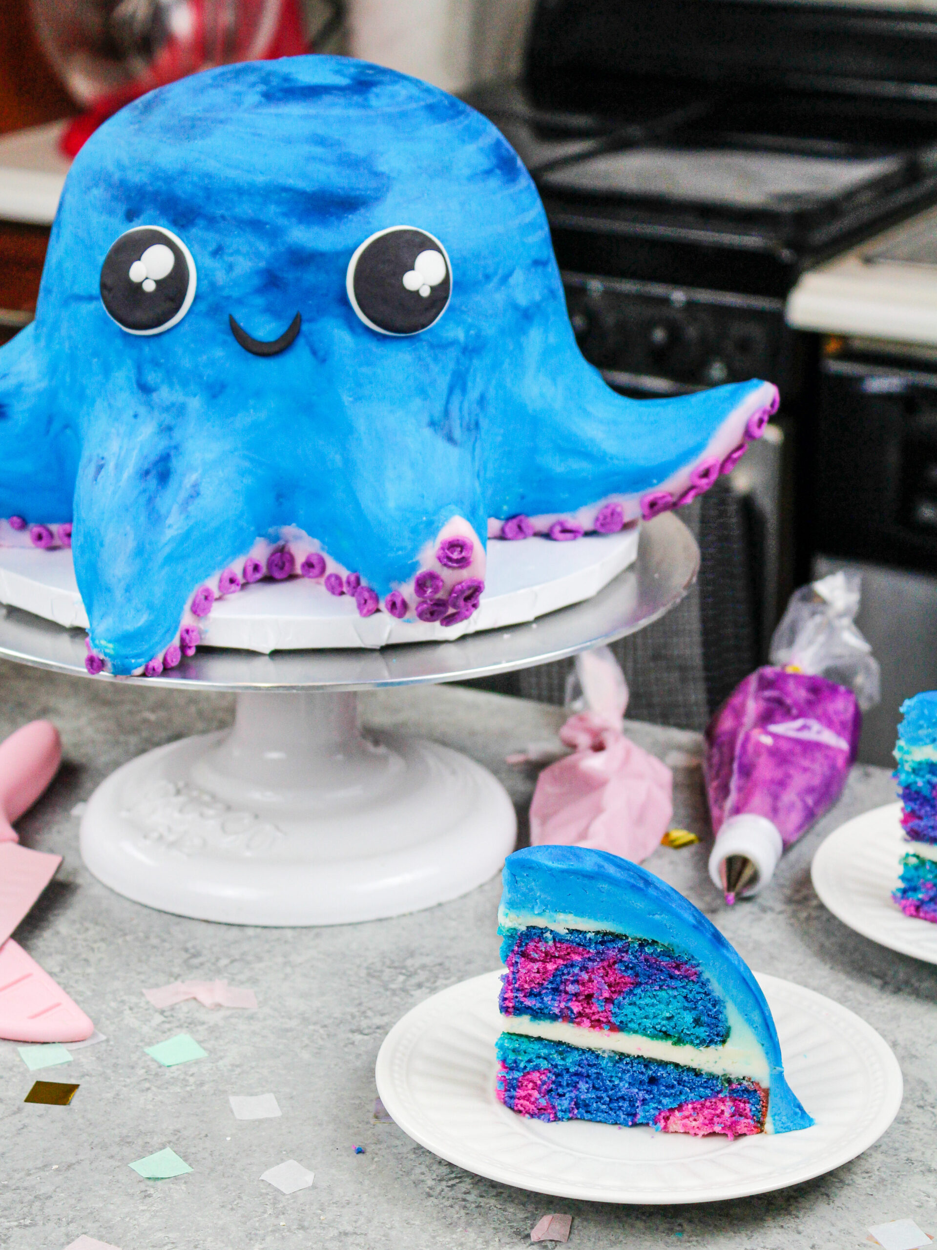 image of an octopus cake made with colorful cake layers and homemade buttercream