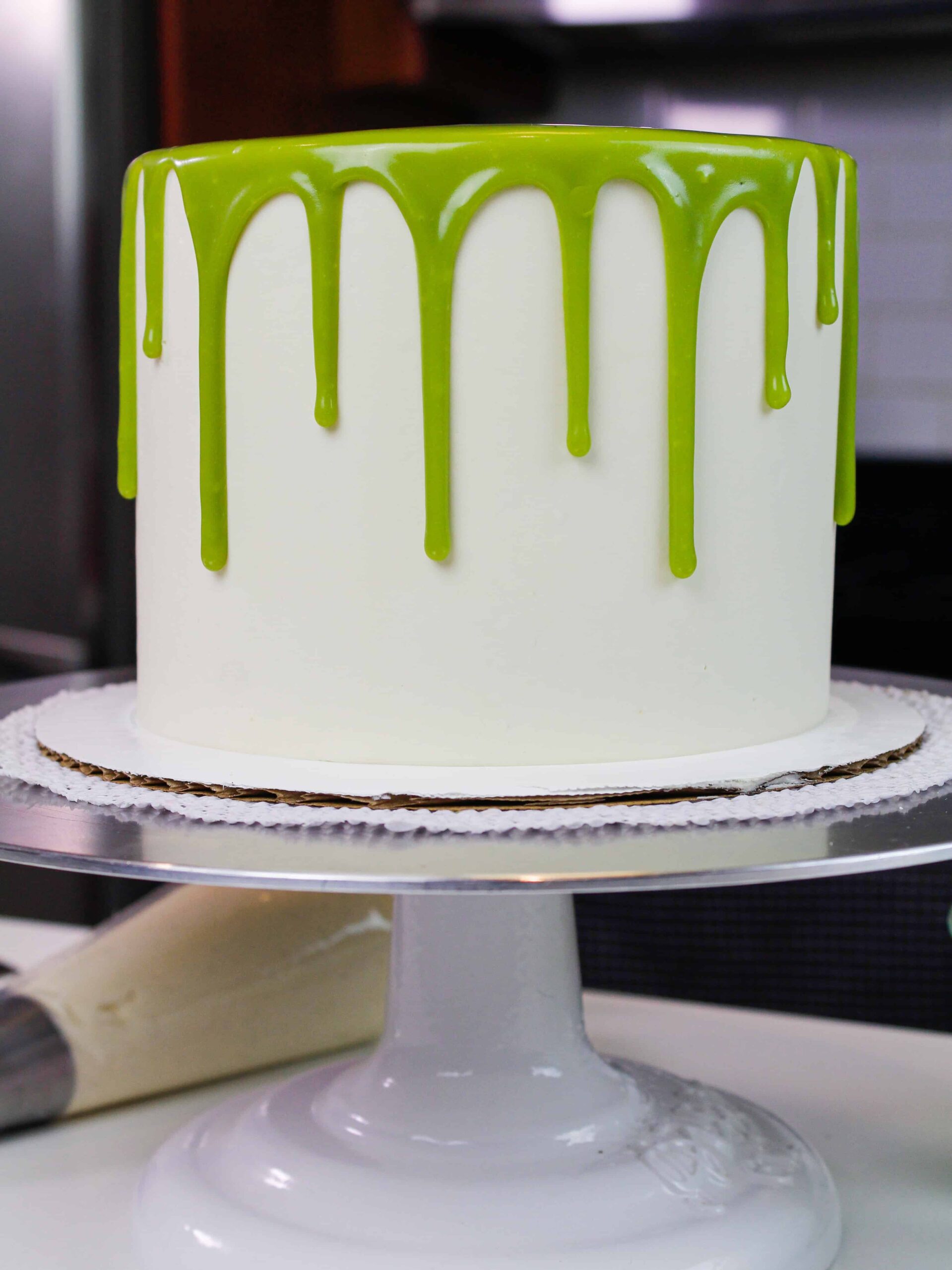photo of a matcha cake decorated with green matcha drips 