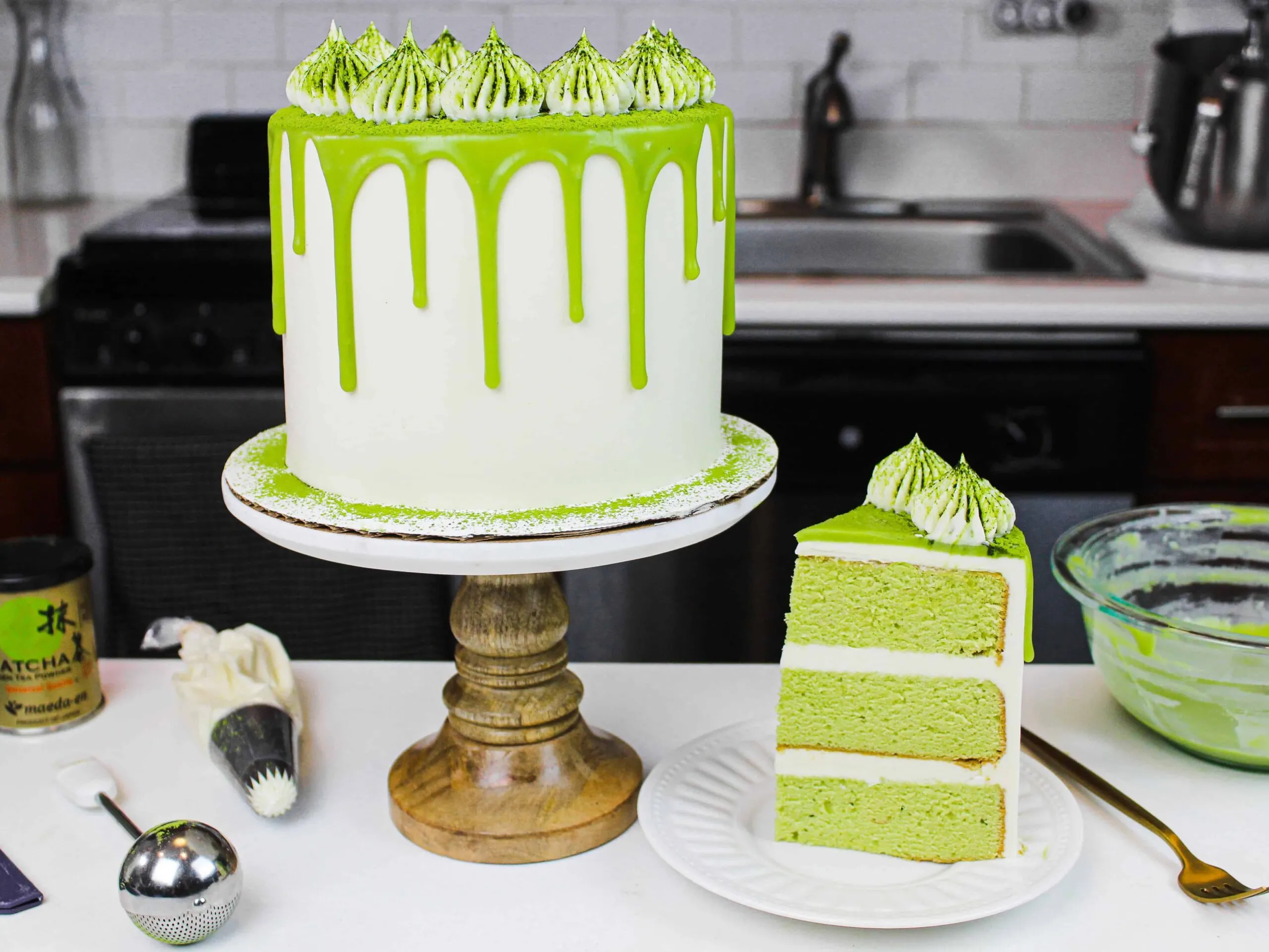 image of a matcha cake, with a slice placed on a plate to show how fluffy and delicious this matcha cake recipe is
