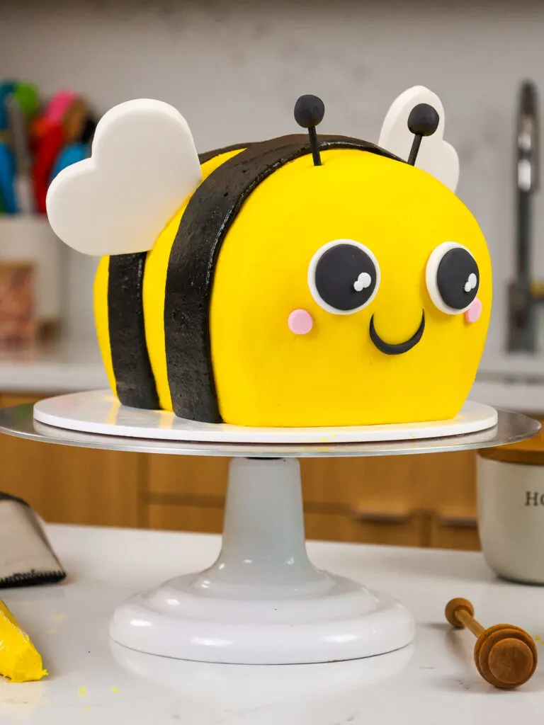 image of an adorable bumblebee cake made with black cocoa and honey buttercream