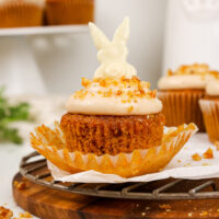 image of a carrot cake cupcake that's been decorated with a cute white chocolate bunny for Easter