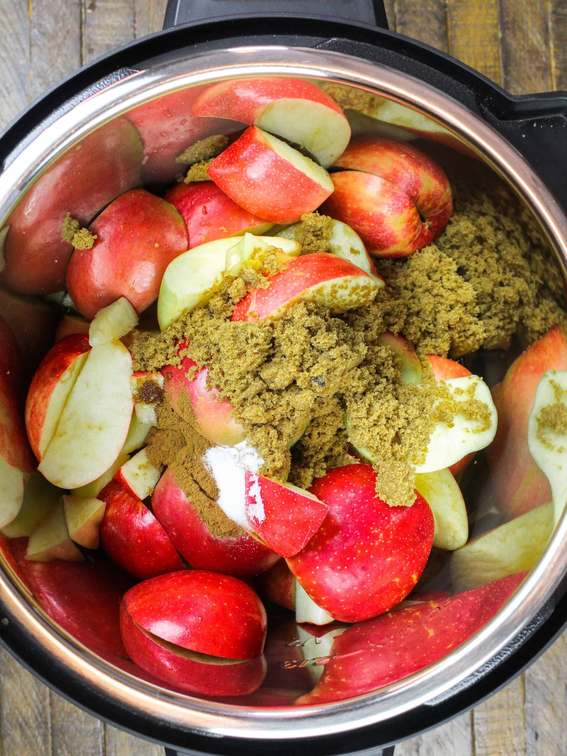 image of ingredients in an instant pot ready to be cooked down into apple butter