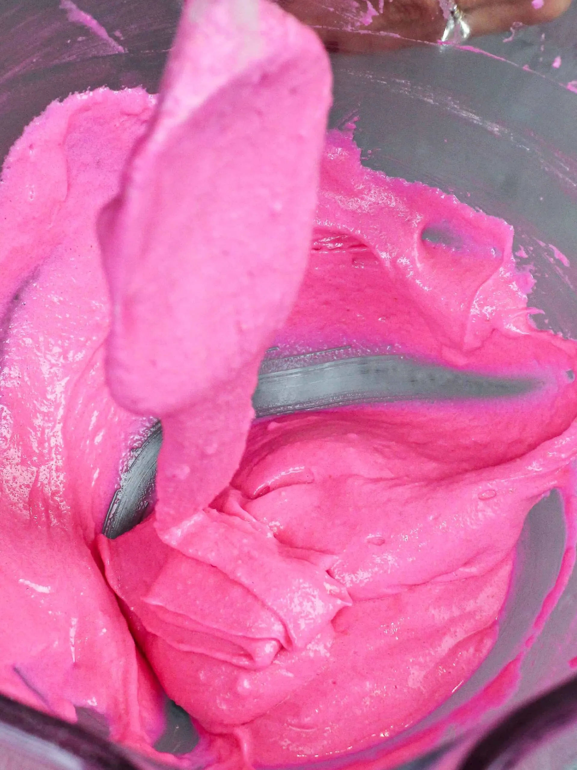 image of pink macaron batter that's been mixed perfectly and is ready to be piped