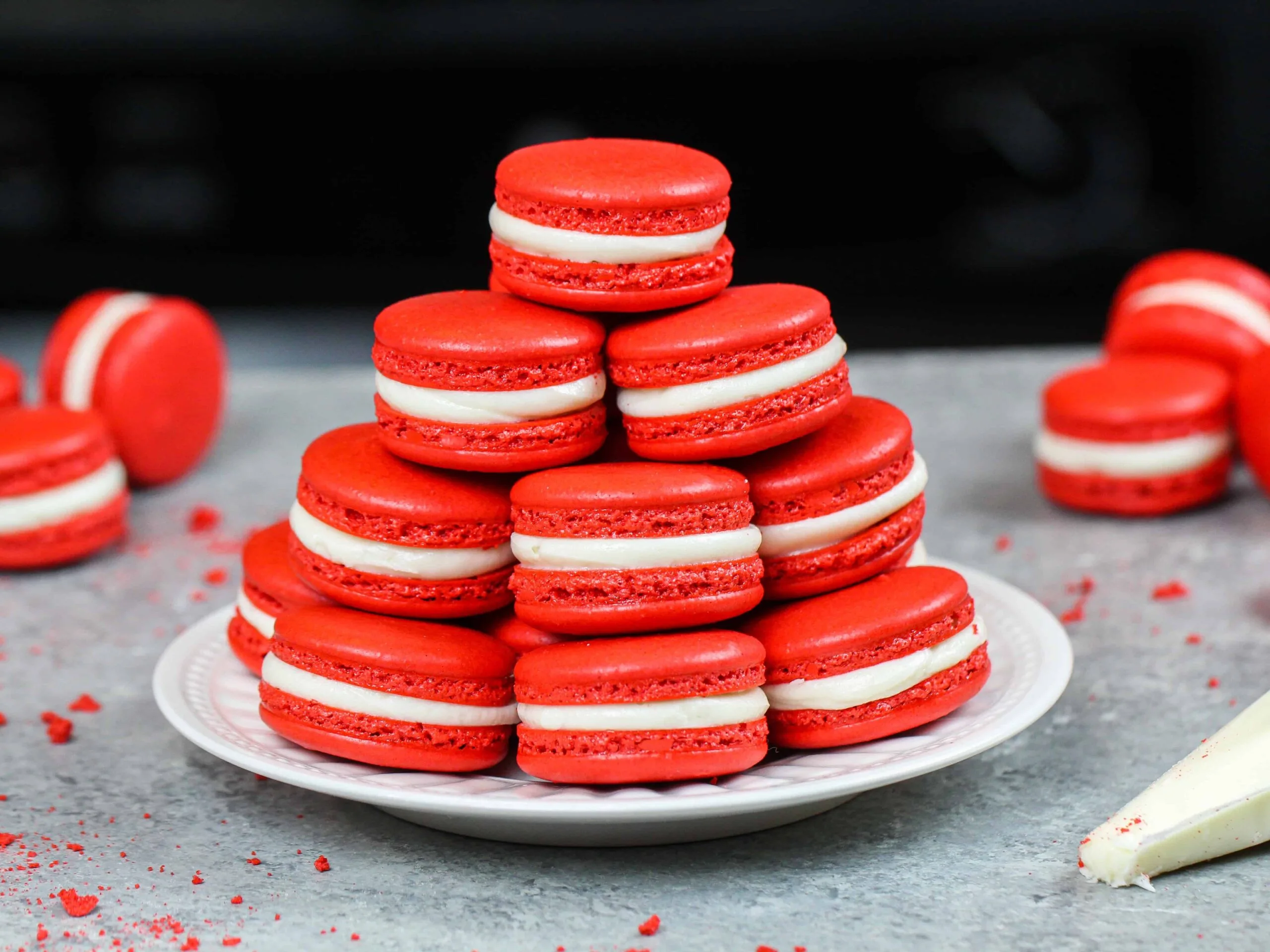 image of red velvet macarons stacked on a plate 
