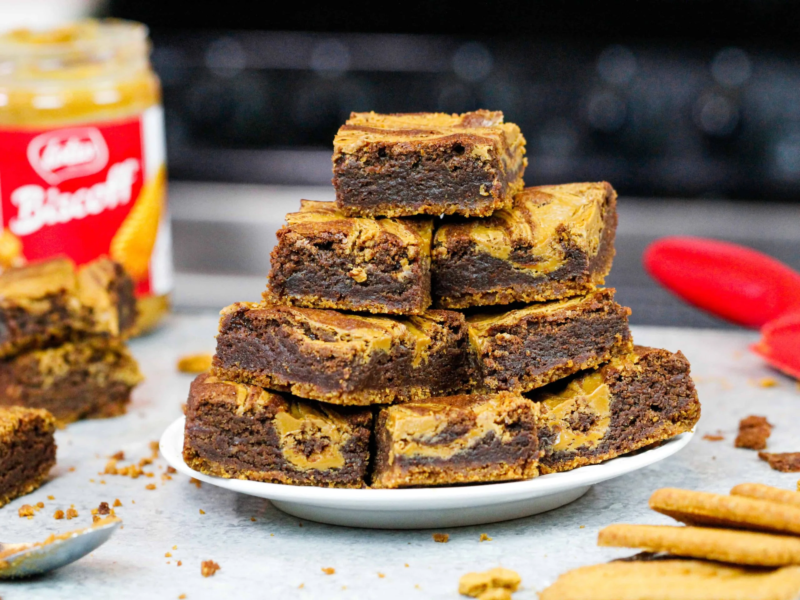 image of biscoff brownies baked and stacked on a plate