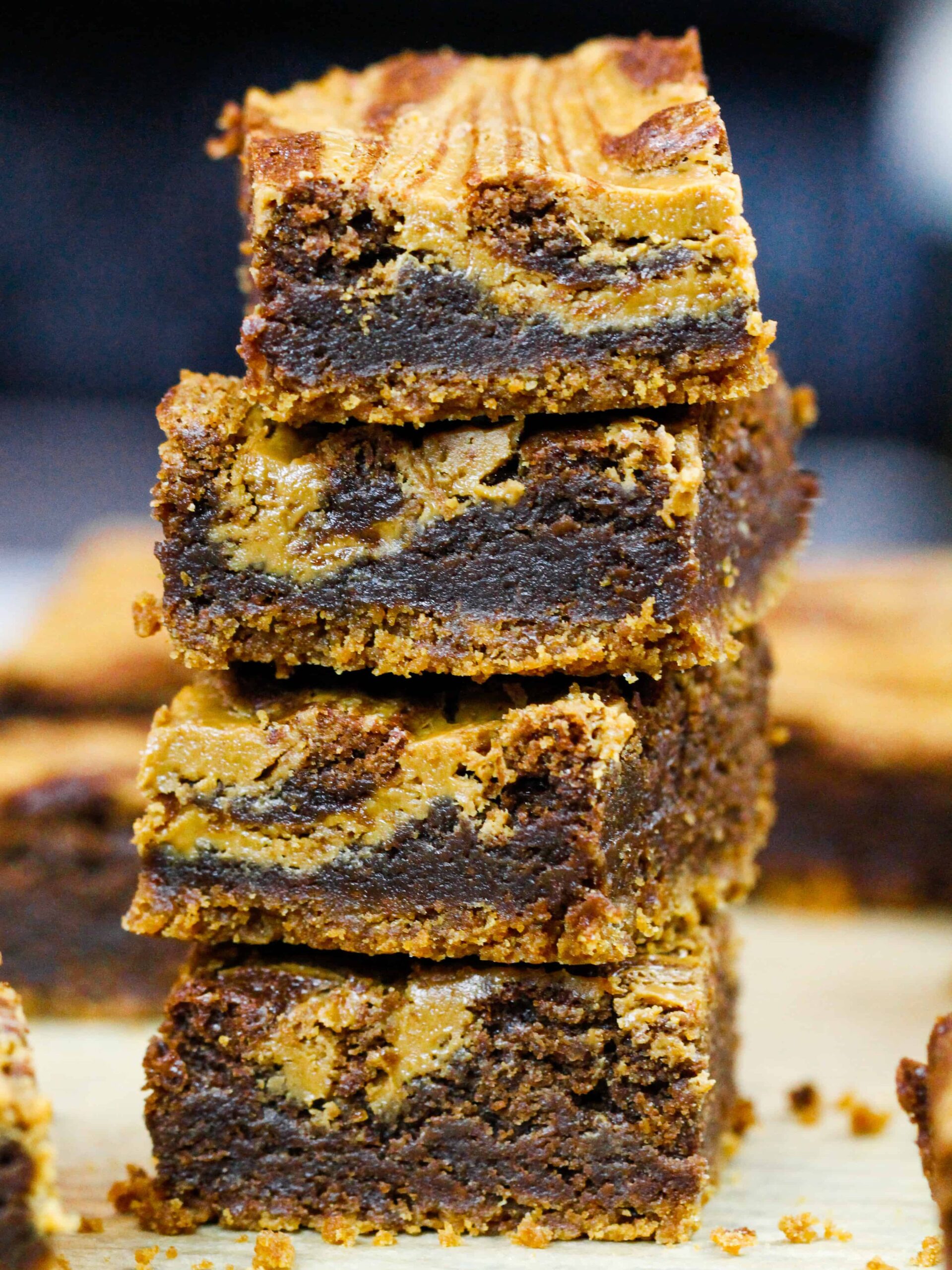 image of biscoff brownies that are stacked on top of each other to show their delicious fudgy texture