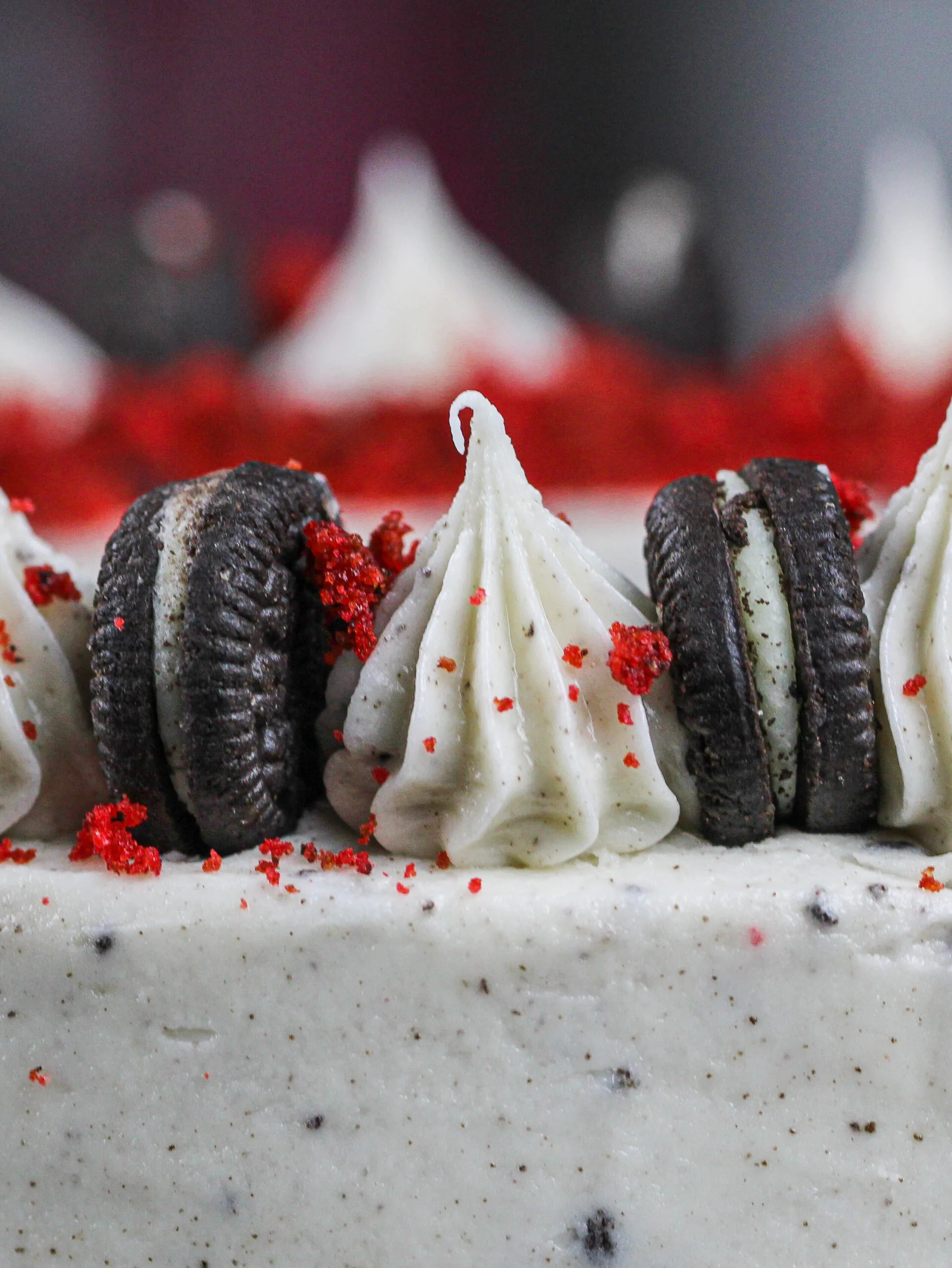 image of oreo cream cheese frosting piped on top of a cake