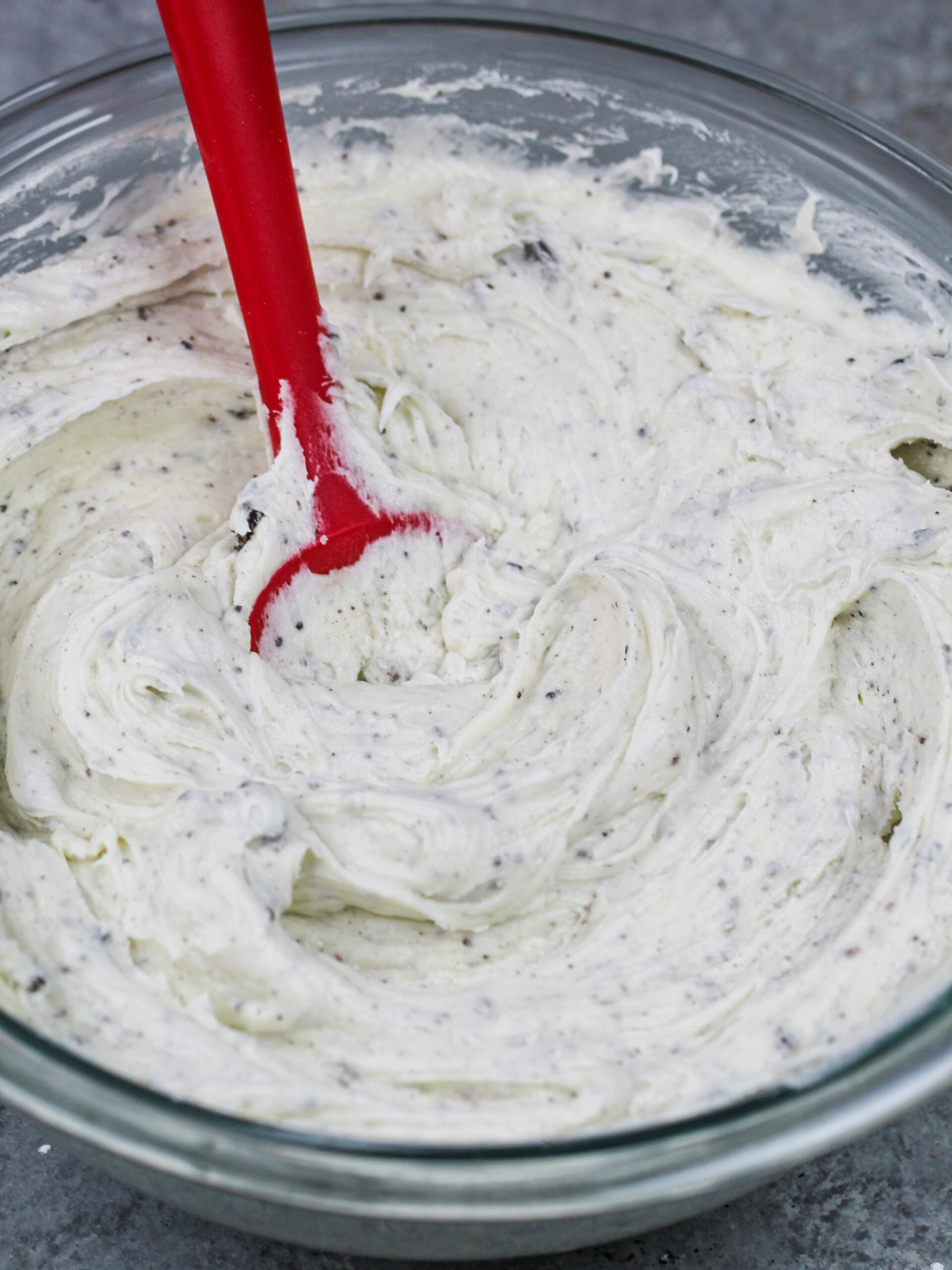 image of oreo cream cheese buttercream frosting made in a glass bowl