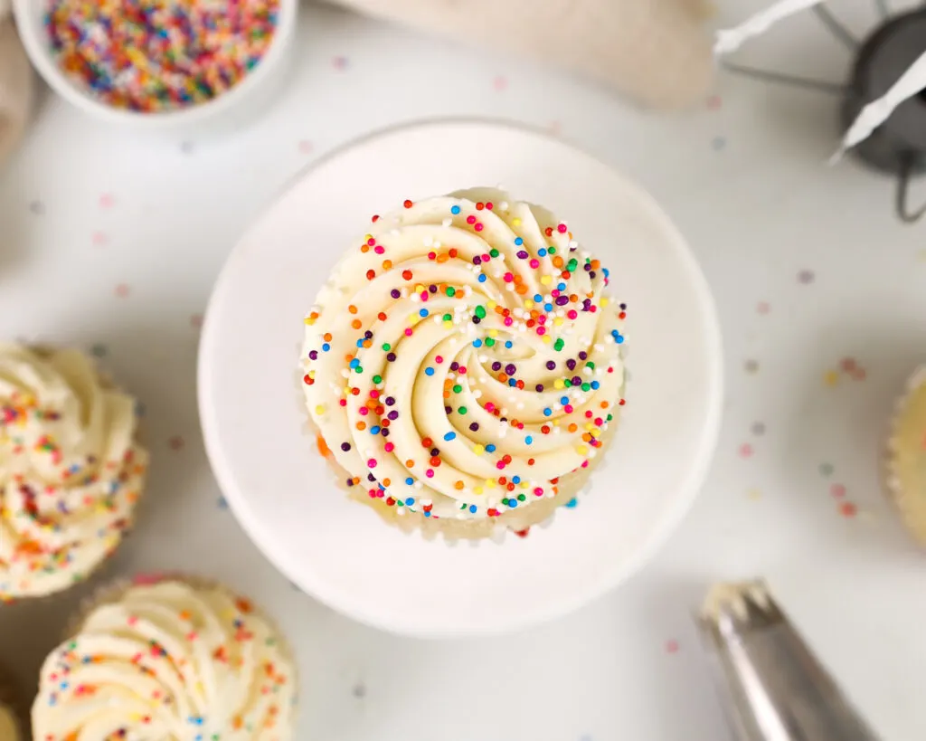 image of a cupcake frosted with perfectly sweet buttercream frosting