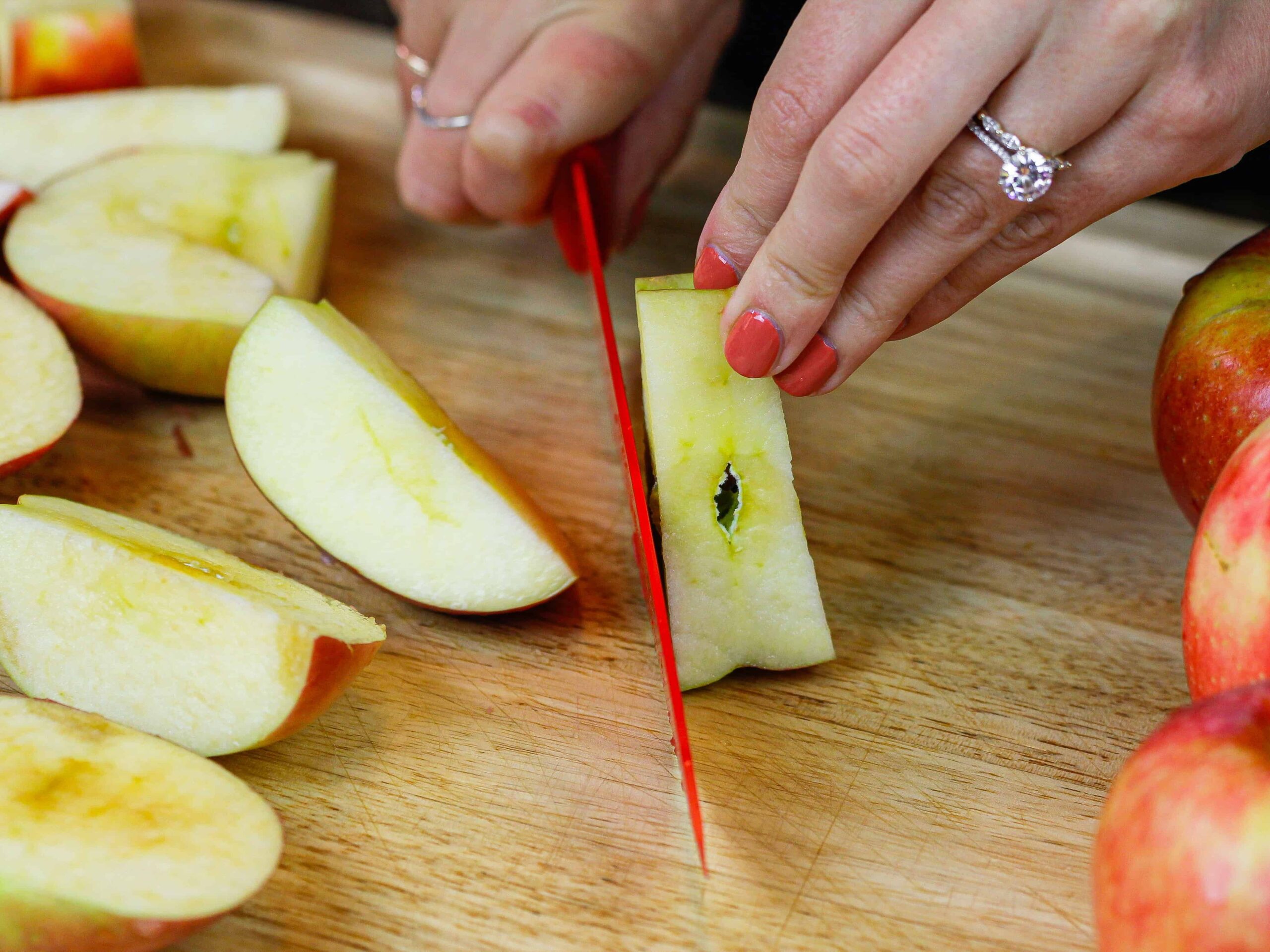 image of apples being cut into quarters to make apple butter
