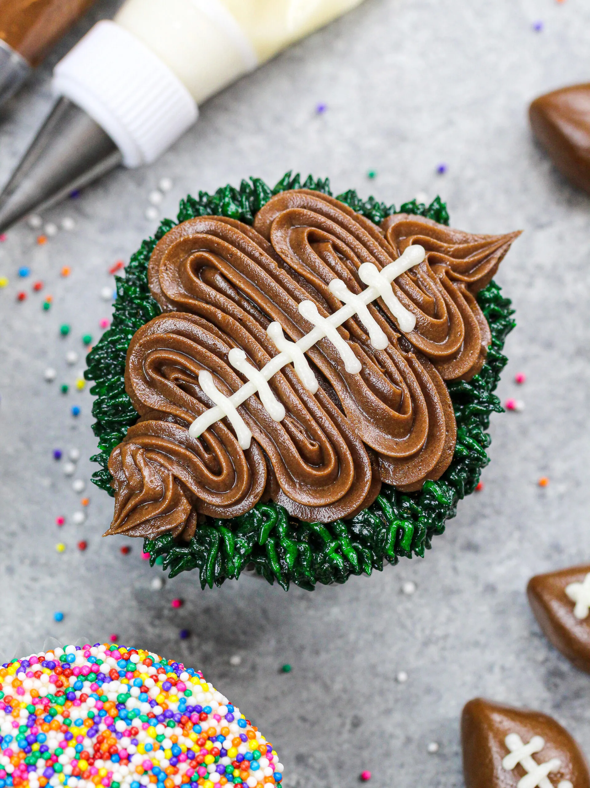 image of a football cupcake decorated with chocolate buttercream