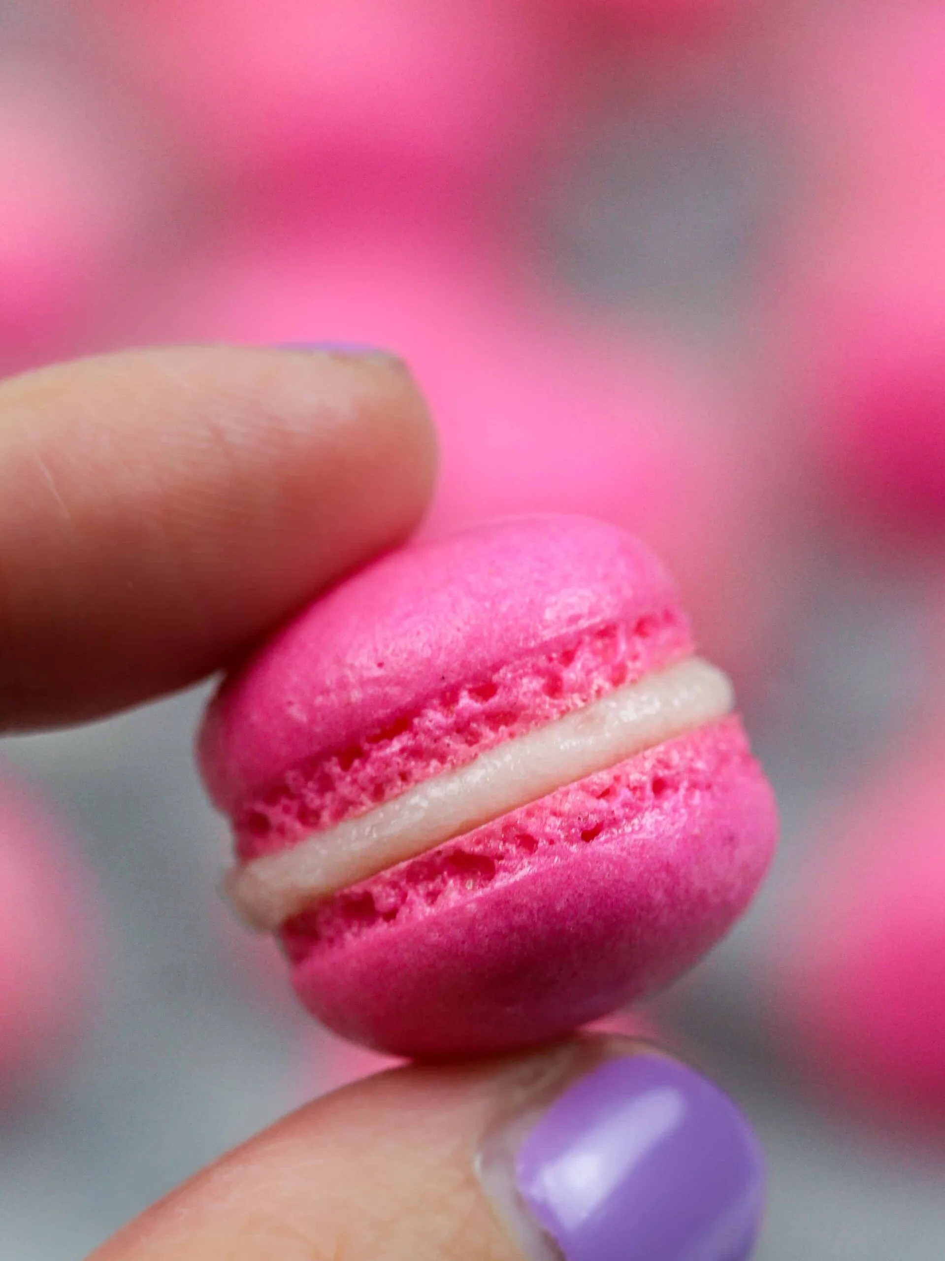 image of a mini macaron filled with buttercream frosting
