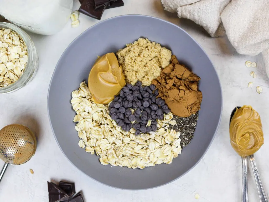 image of ingredients in a bowl to make chocolate overnight oats