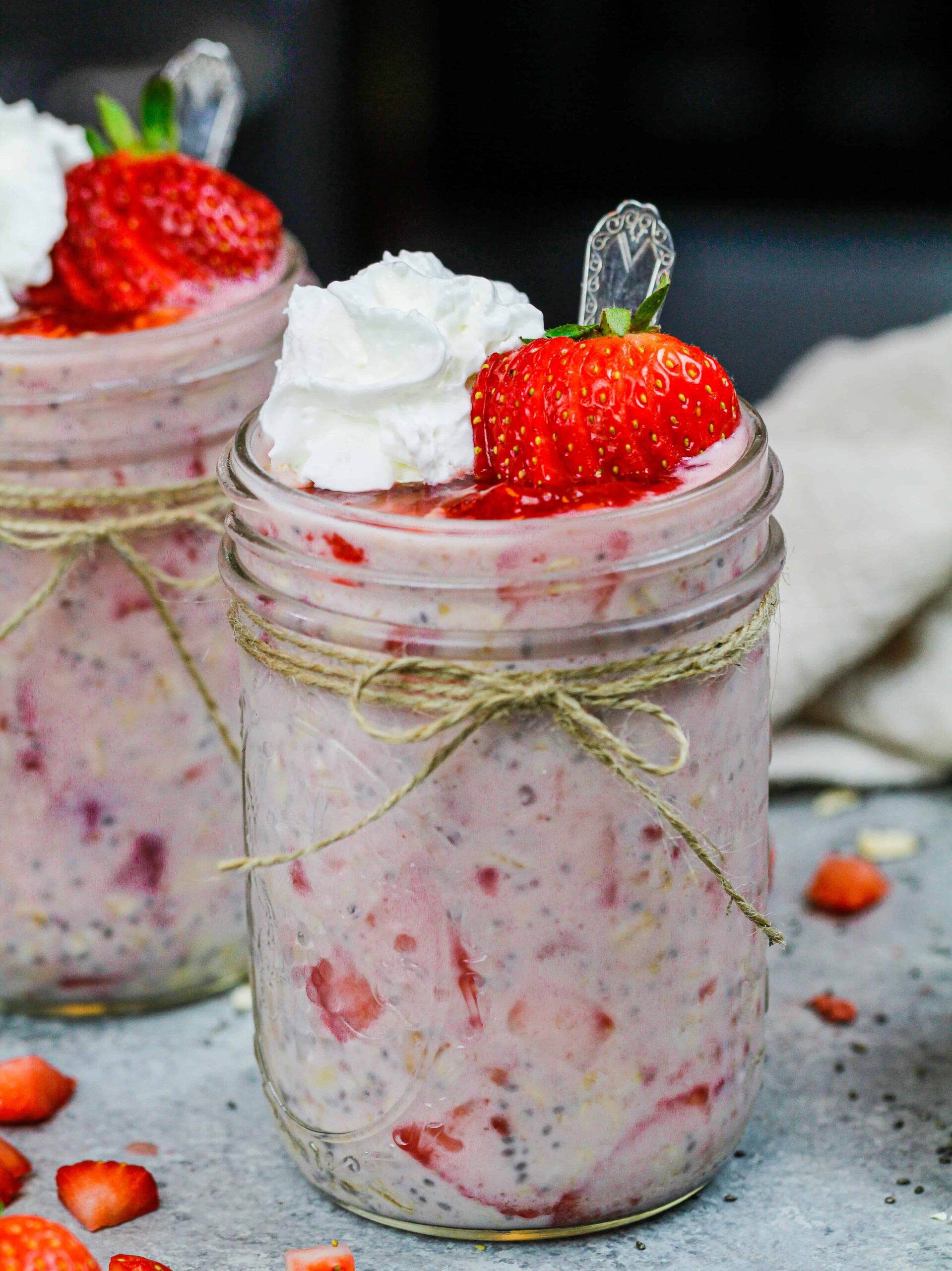 image of strawberry overnight oats in cute mason jars