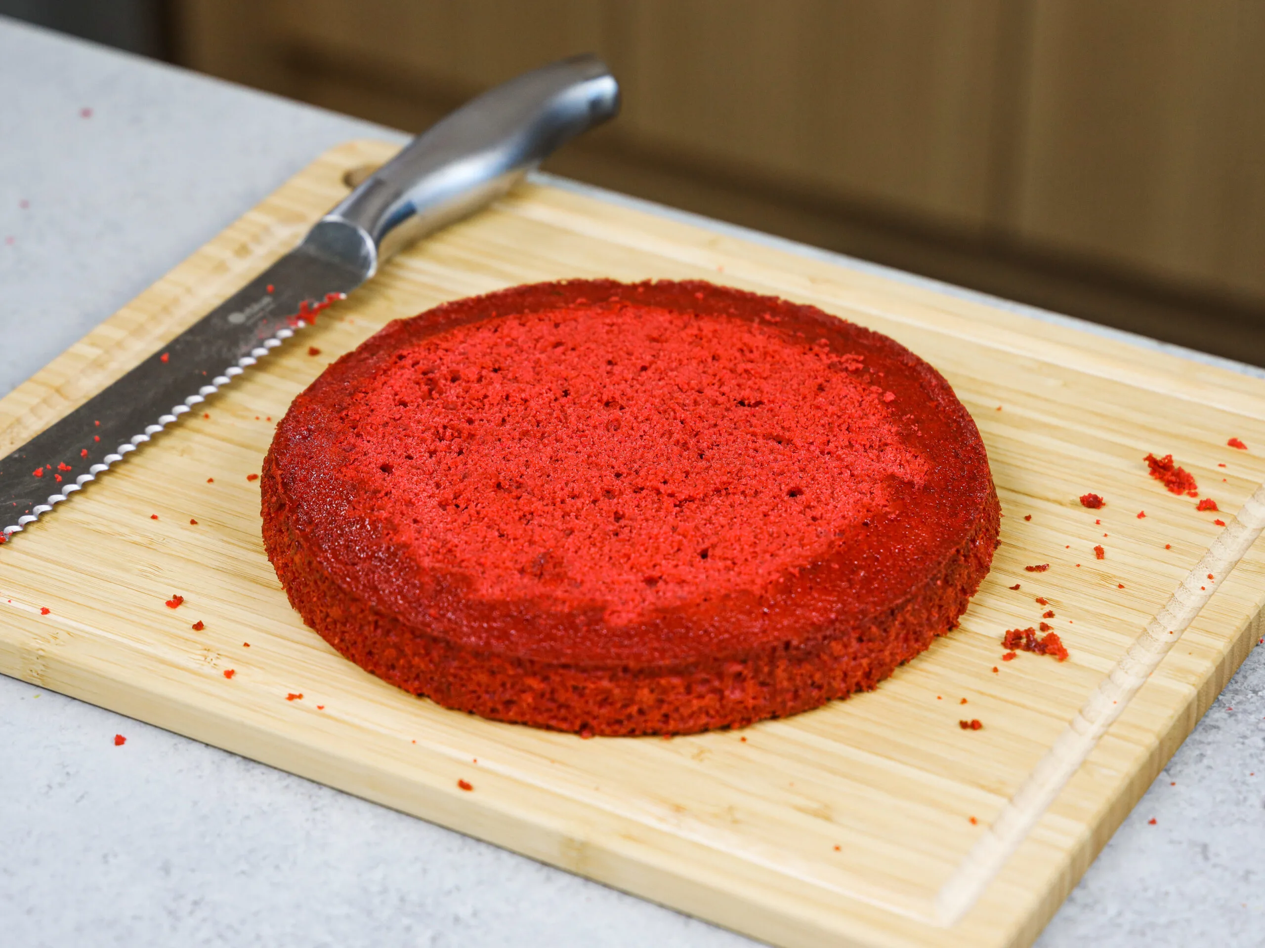 image of an 6 inch red velvet cake layer that's been leveled with a serrated knife