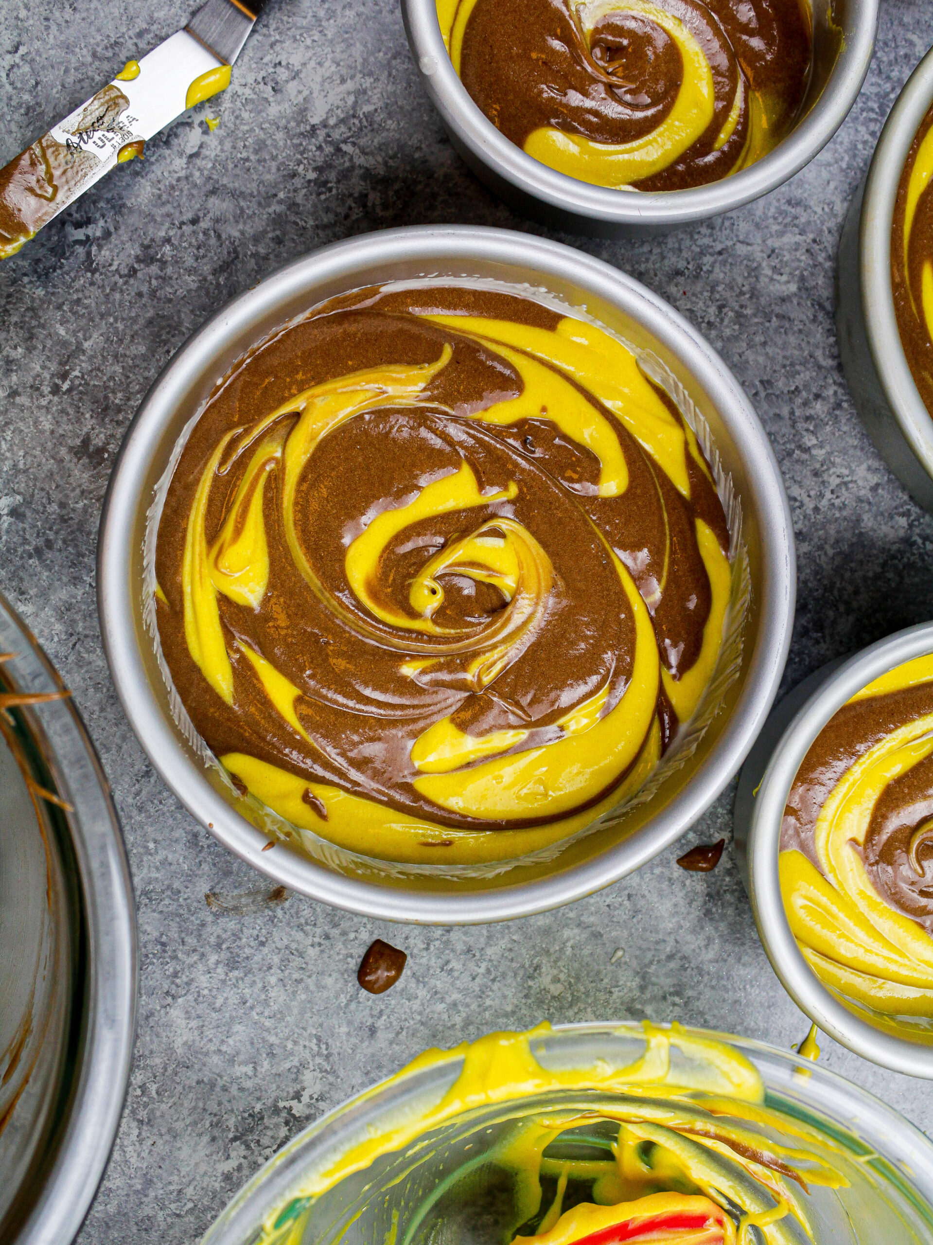 image of yellow marble cake layers that are ready to be baked 