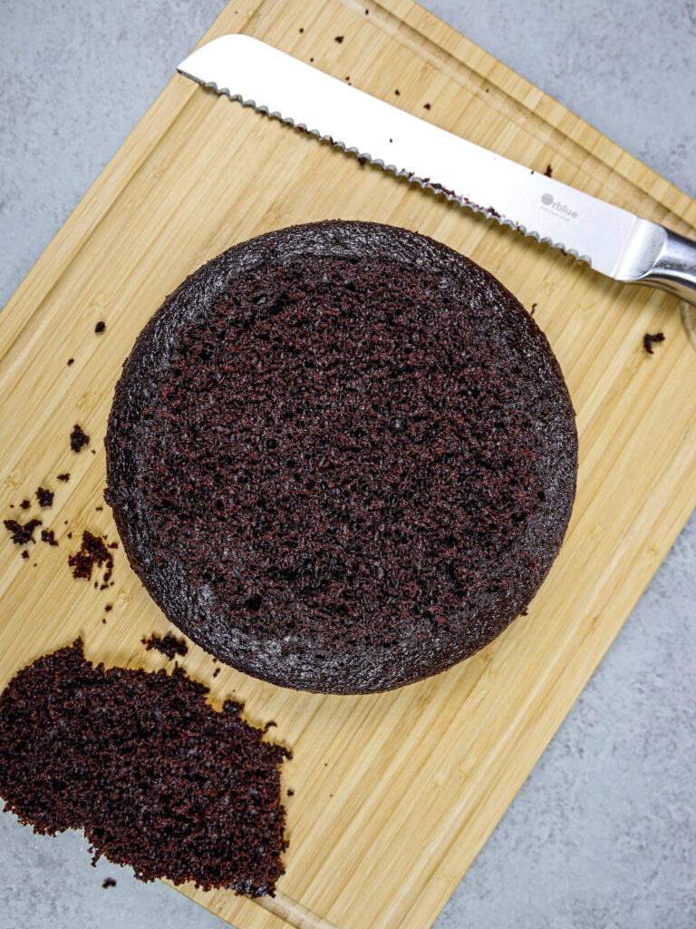 image of a moist chocolate cake layer that's been leveled with a serrated knife to make the cake easier to stack