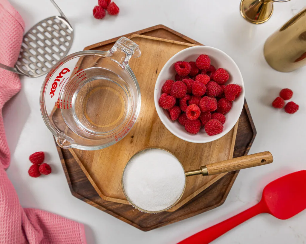 image of ingredients laid out to make raspberry simple syrup