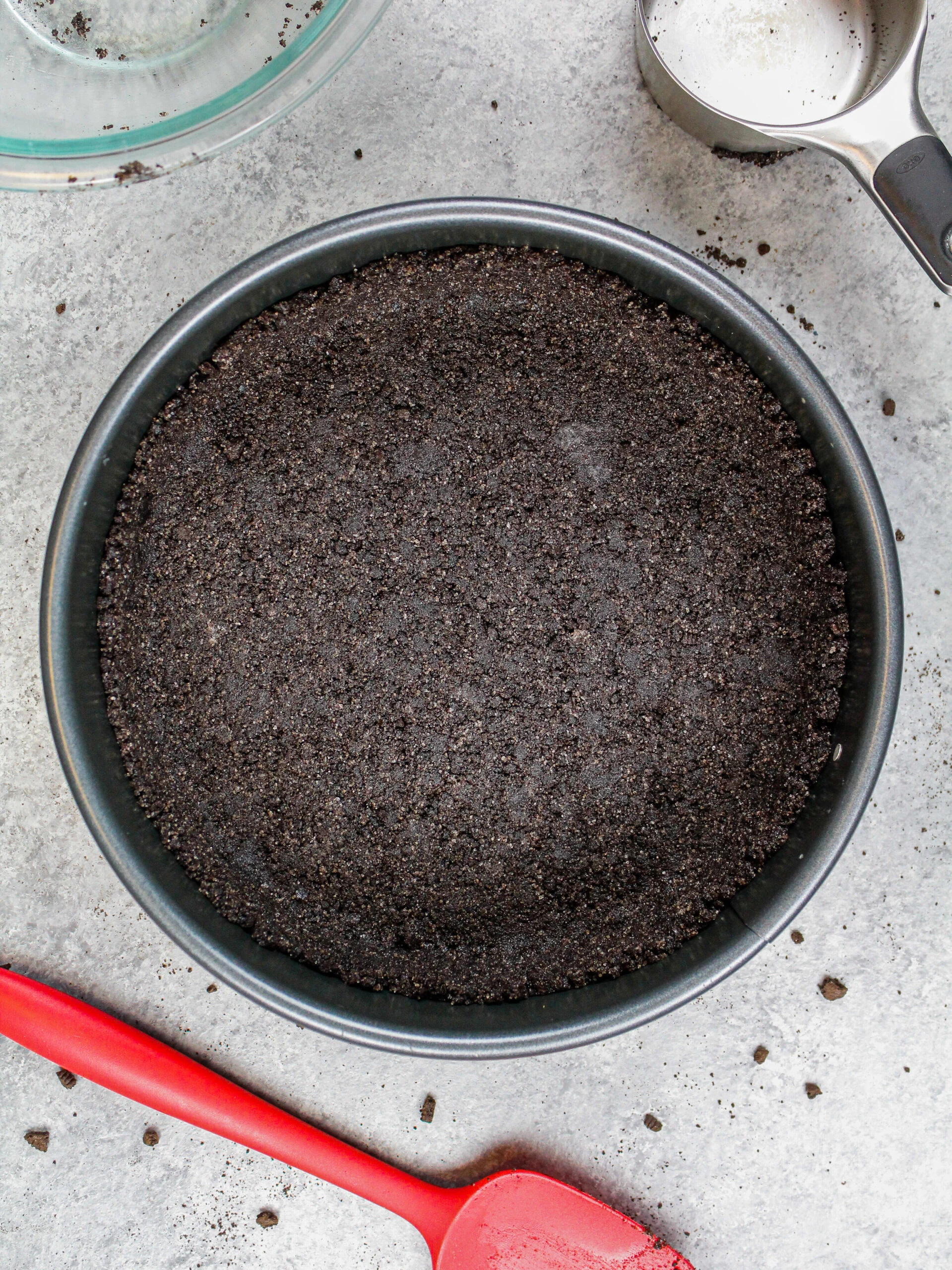 image of an oreo crumb crust about to be baked for a cheesecake