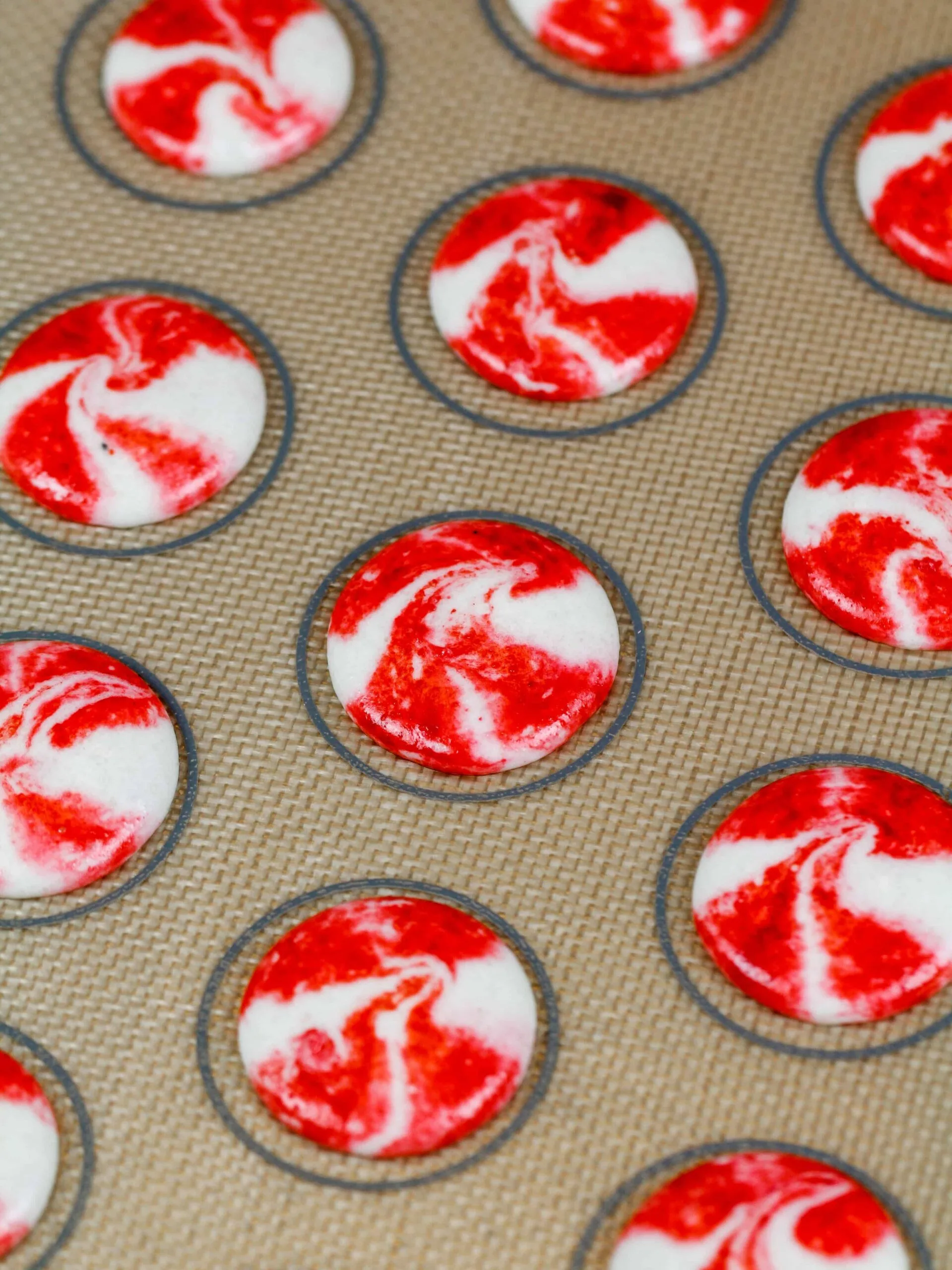 image of piped french peppermint macaron shells that are ready to be rested before being baked