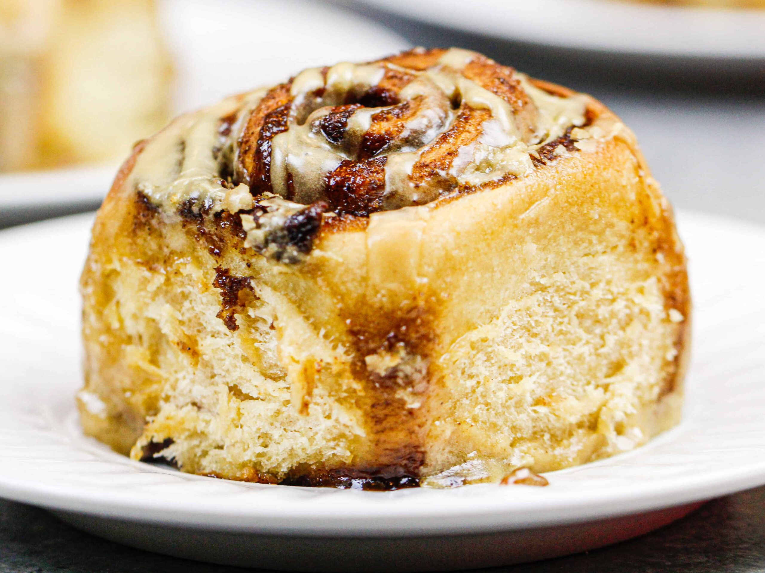 image of a coffee flavored cinnamon roll on a plate