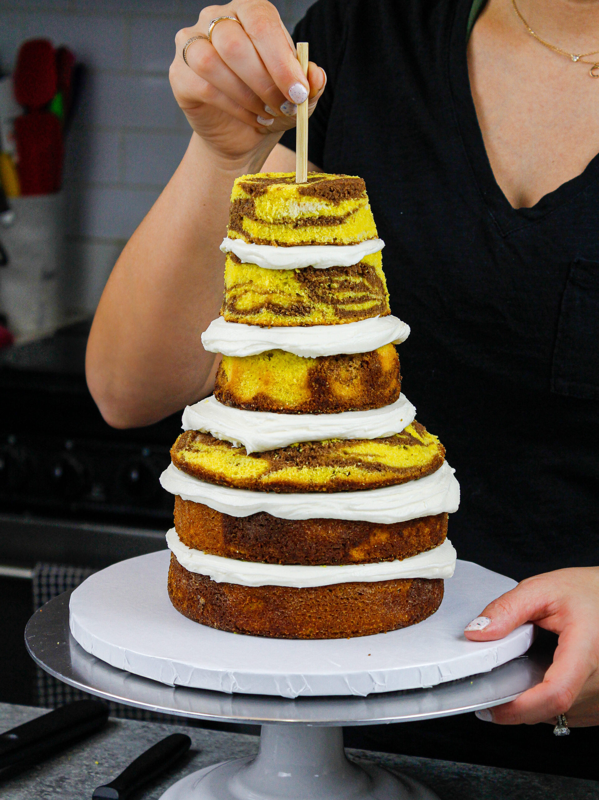 image of yellow marble cake layers that have been stacked and trimmed to make a giraffe cake
