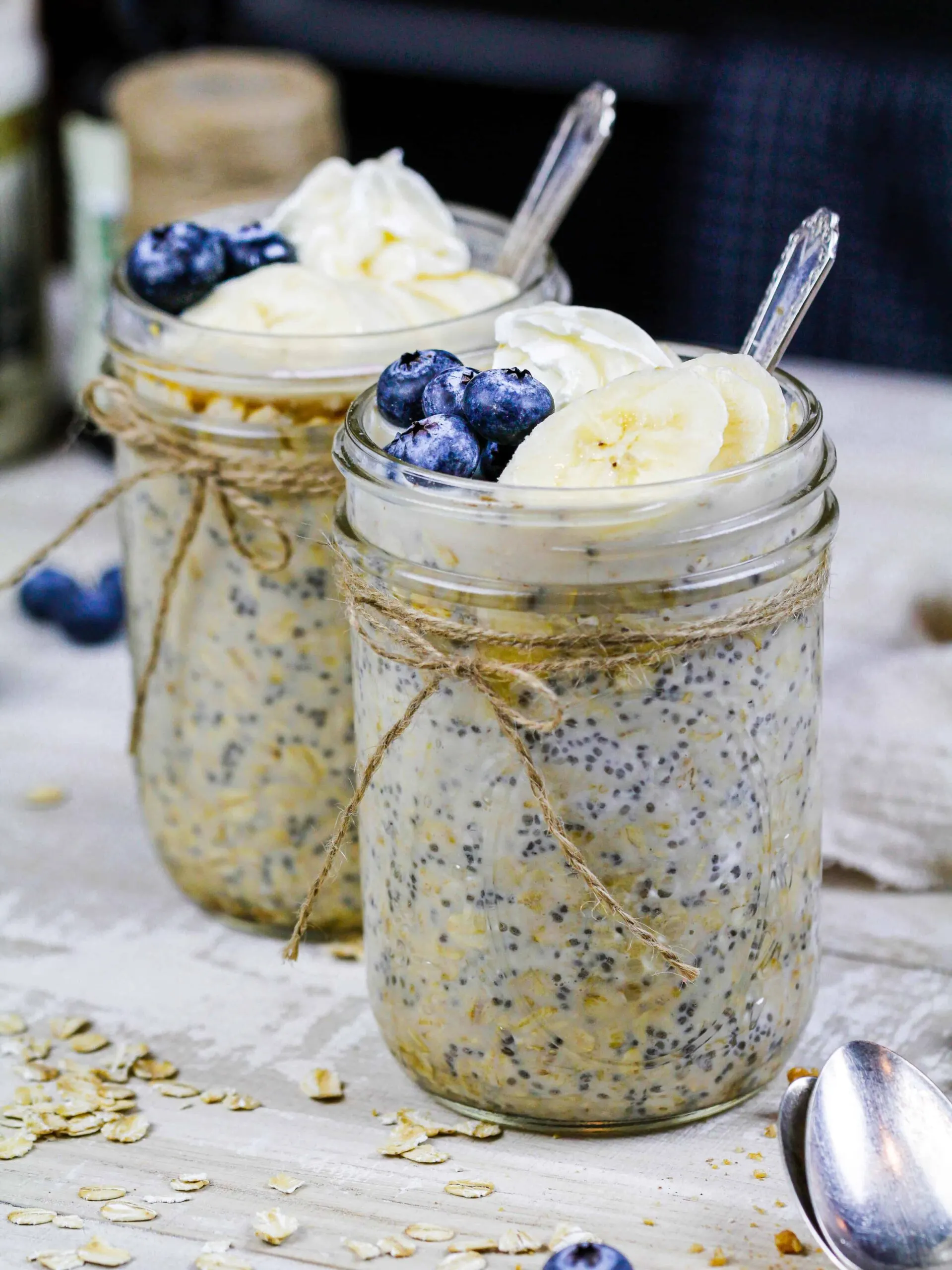 image of maple overnight oats made in cute mason jars and topped with fresh fruit