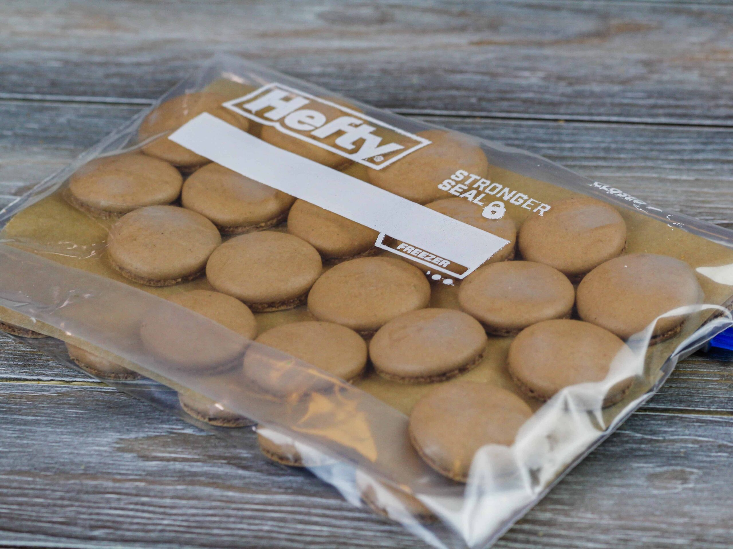 image of chocolate macarons shells made in advance and frozen in a ziploc bag