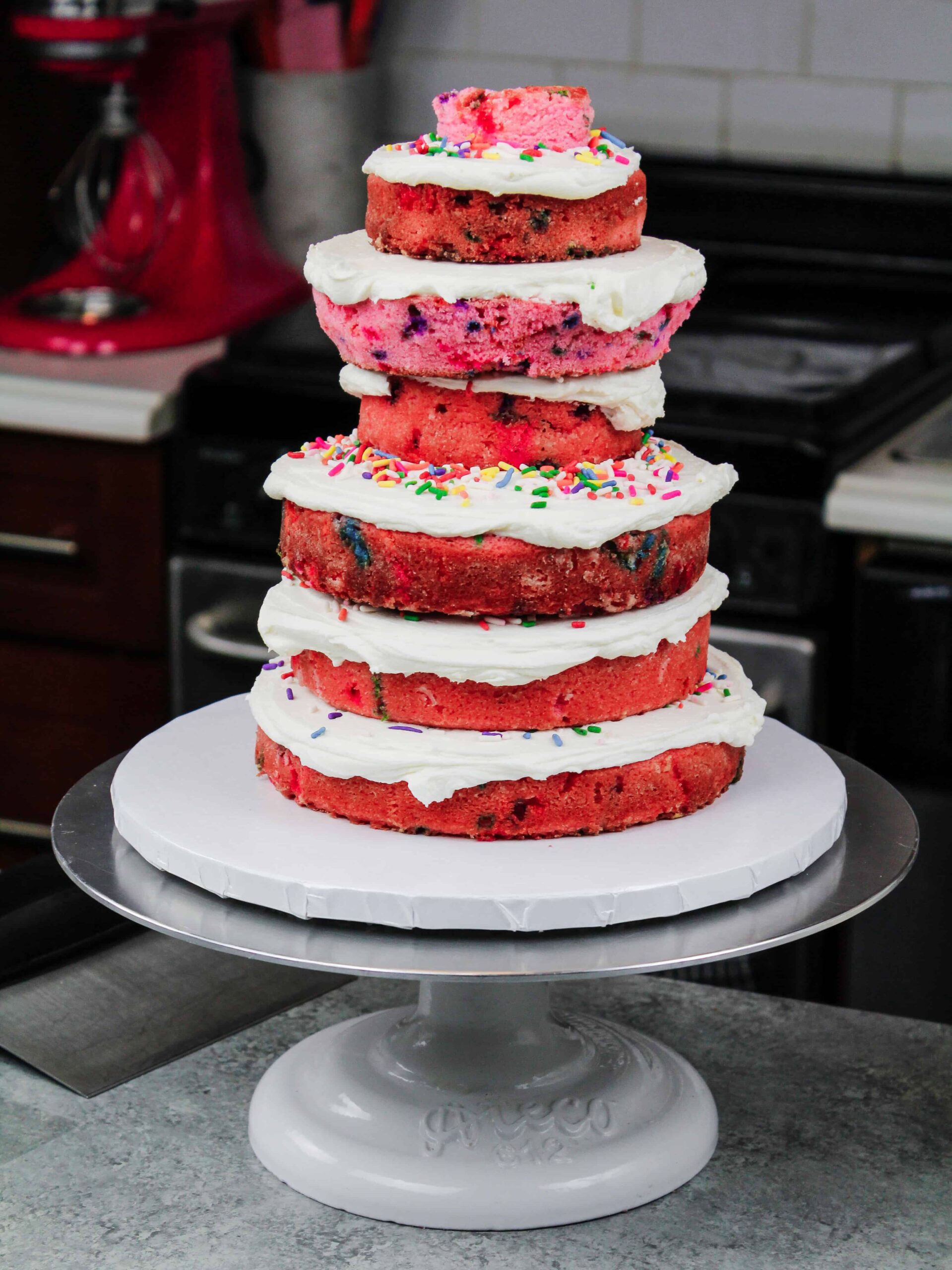 image of pink funfetti cake layers stacked to make an elephant cake