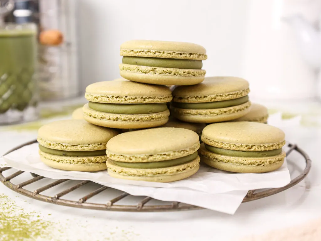 image of matcha macarons stacked and filled with matcha white chocolate ganache