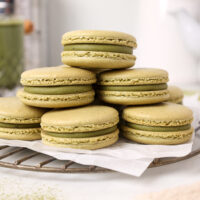 image of matcha macarons stacked and filled with matcha white chocolate ganache