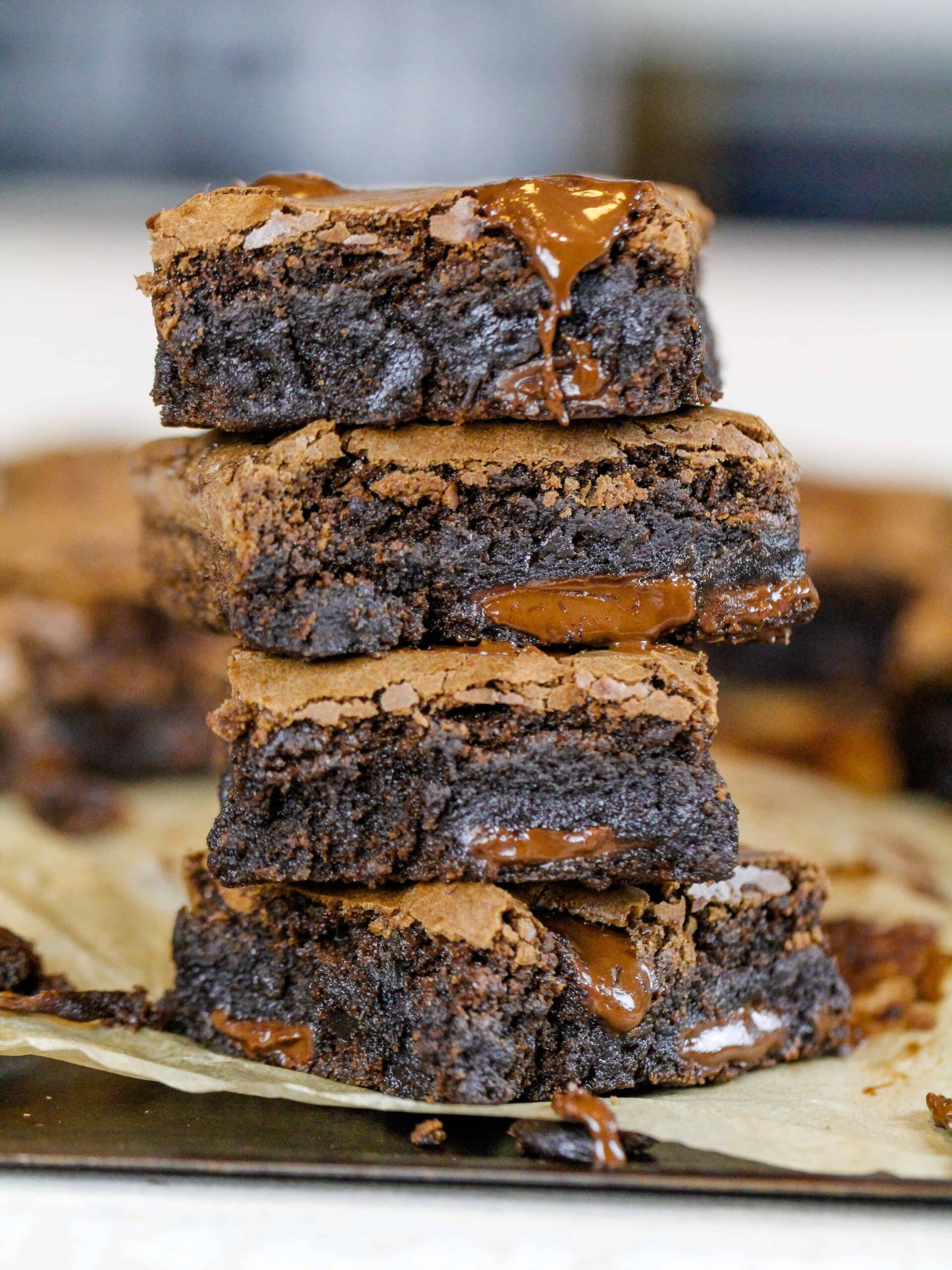 image of dairy free brownies cut and stacked on top of each other
