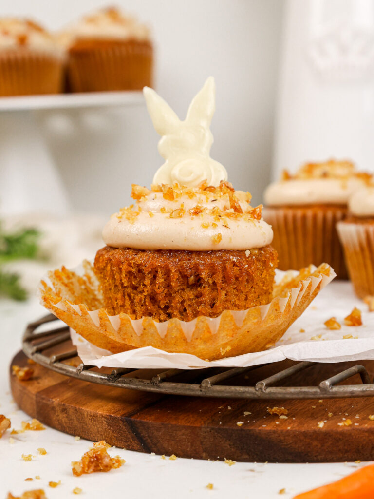image of a cute carrot cake cupcake decorated for Easter with a white chocolate bunny