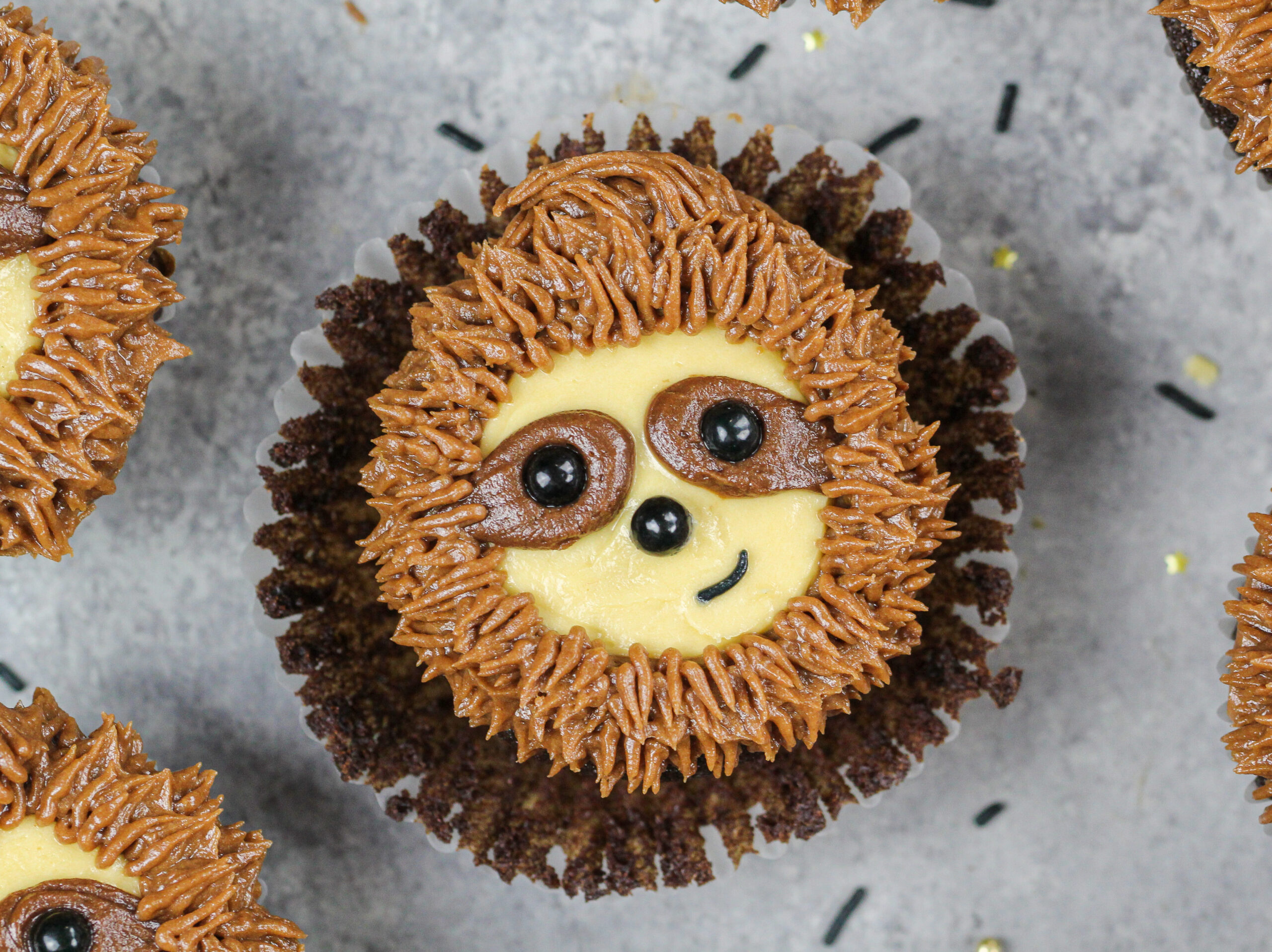 image of a sloth cupcake that's been unwrapped and is ready to be eaten