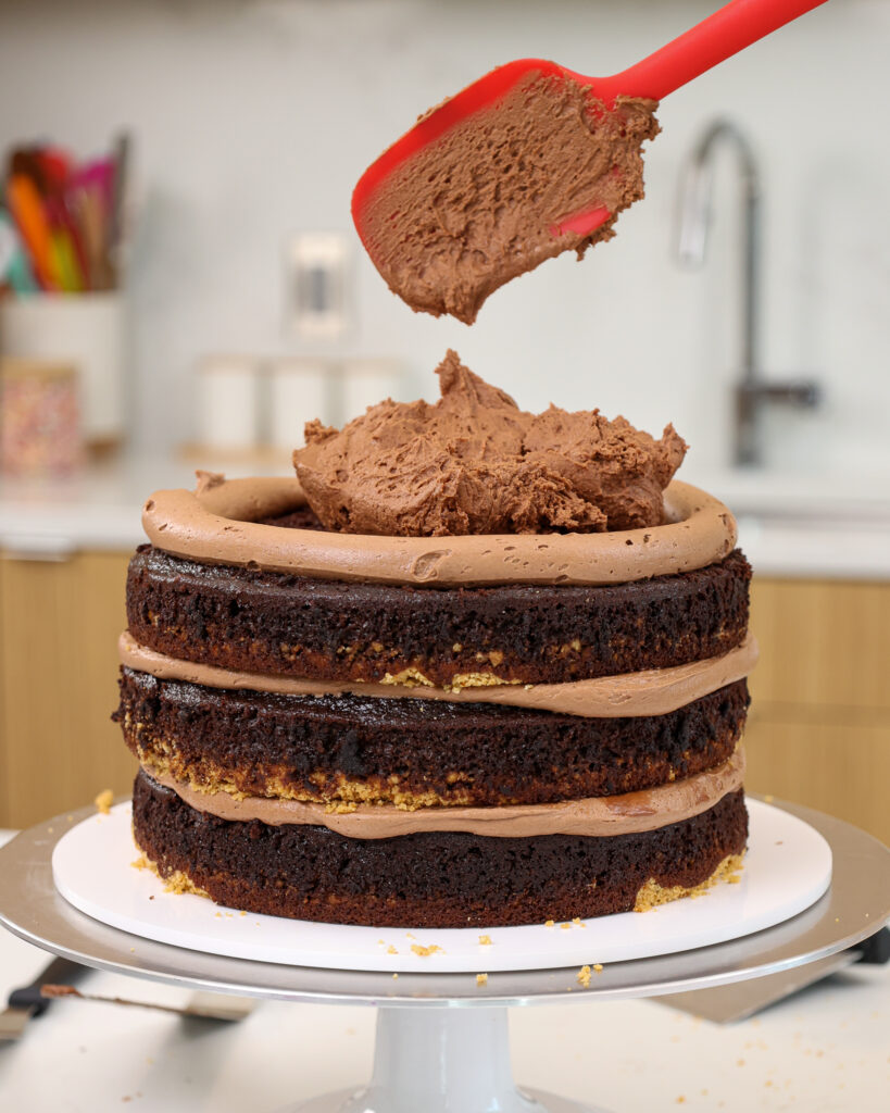 image of hazelnut mouse being used to fill a kinder bueno cake