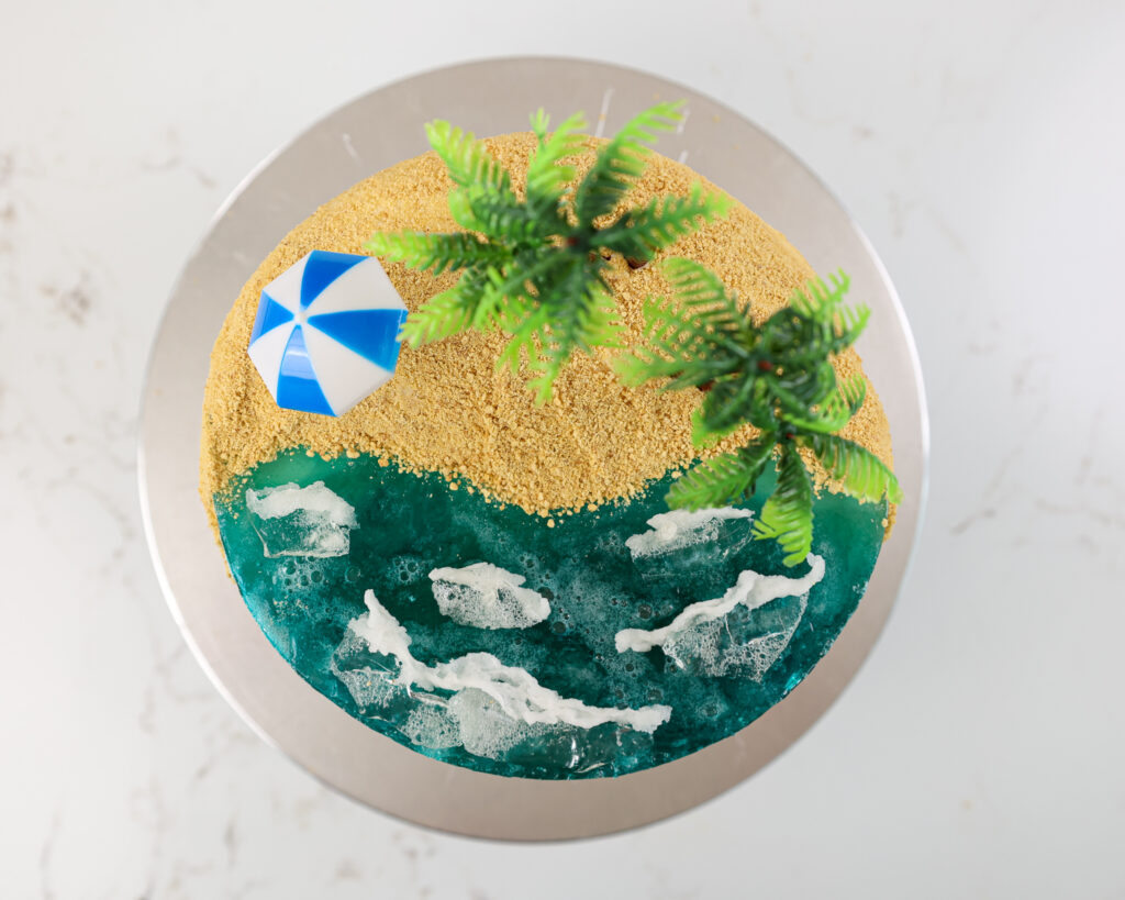 image of a summer beach cake made with jelly ocean