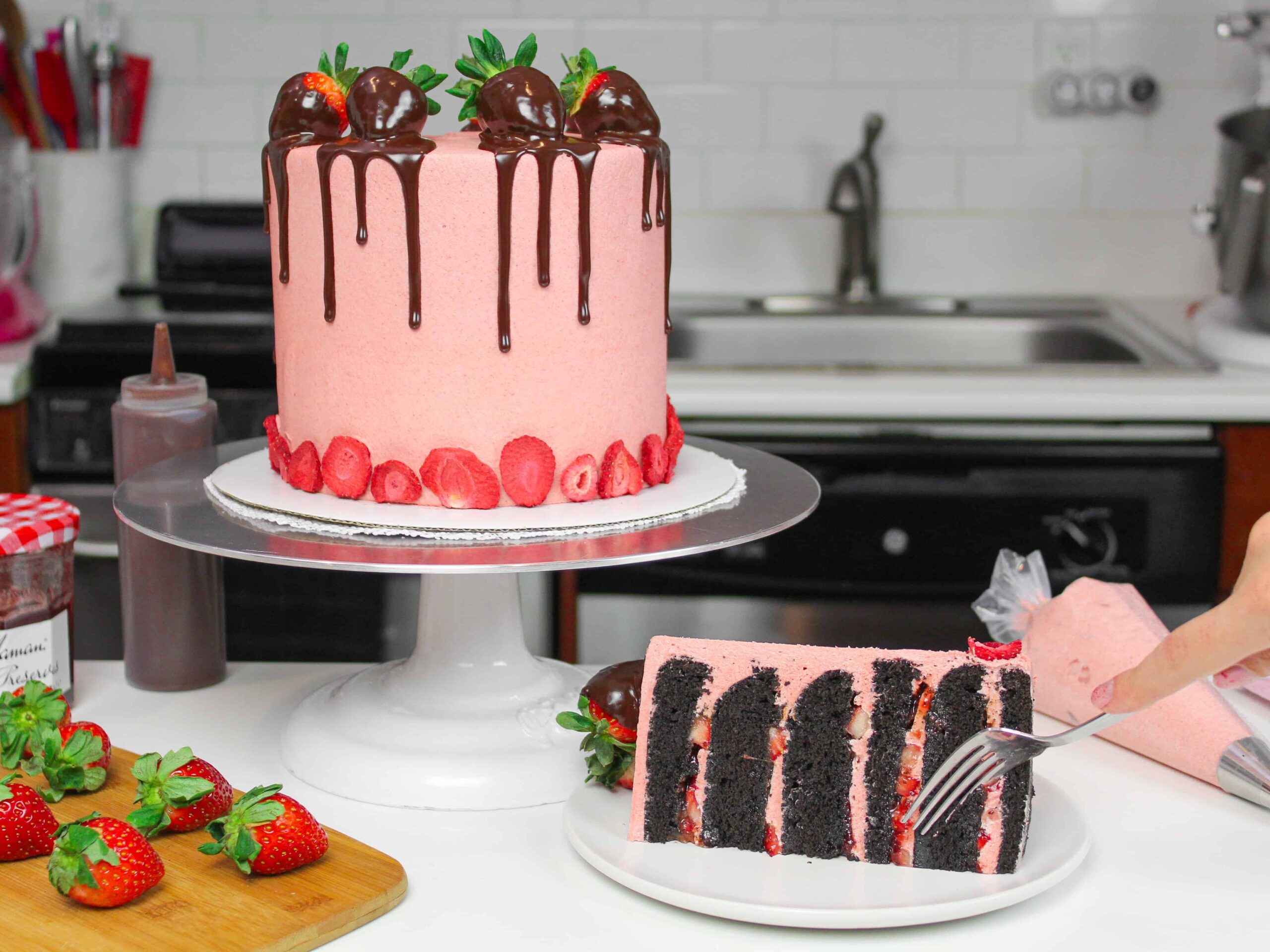 image of dark chocolate strawberry cake with slice cut