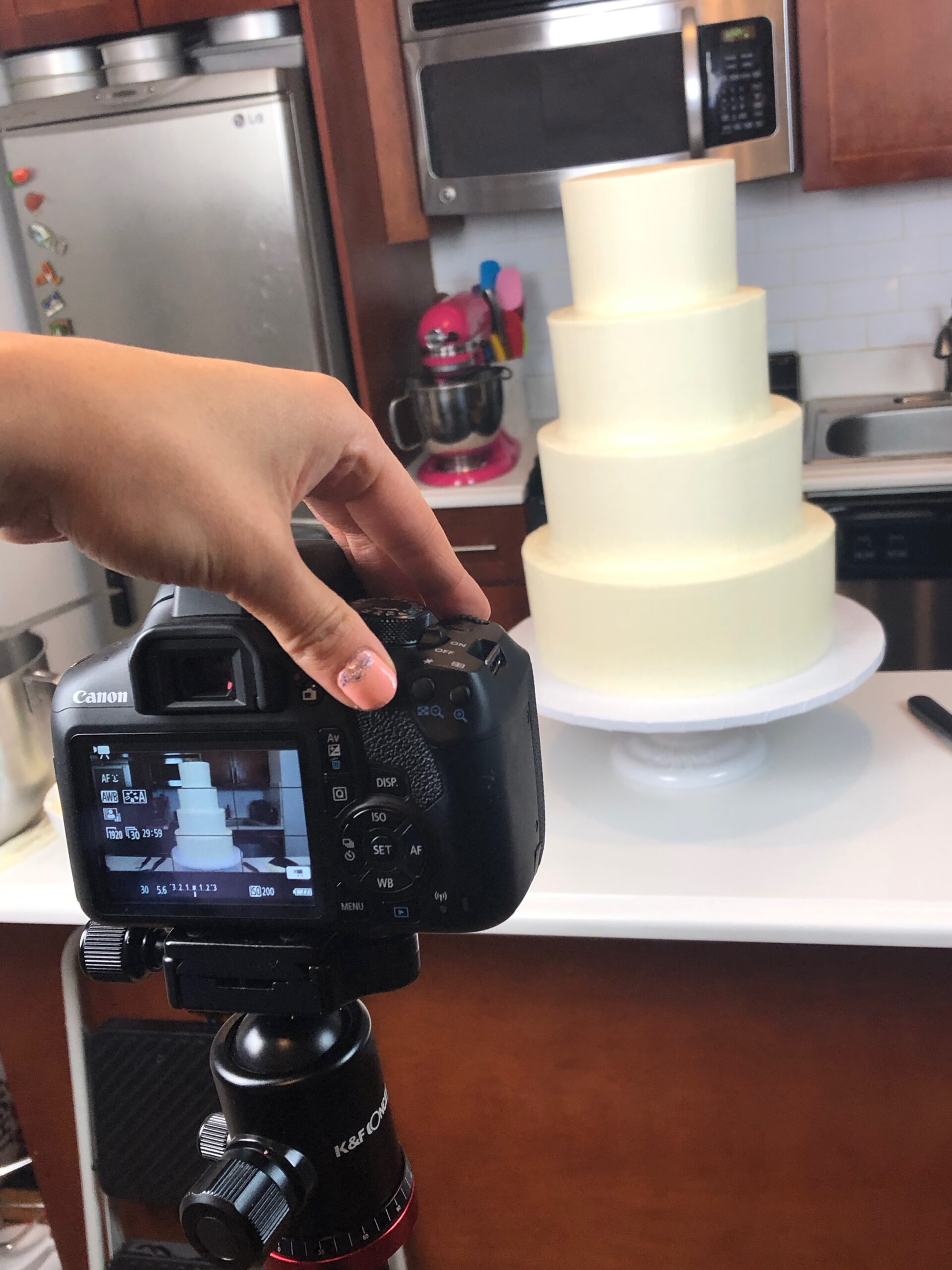 image of a cake video being made of a wedding cake