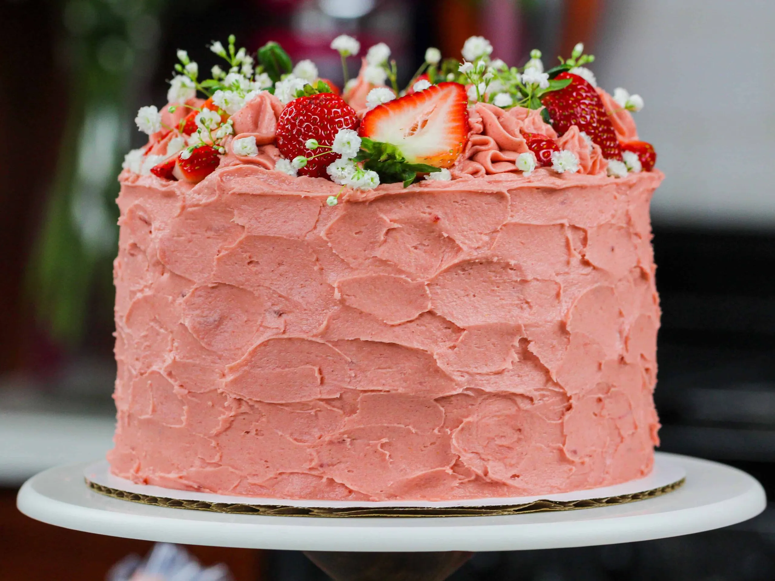 image of strawberry vanilla cake frosted with a real strawberry buttercream frosting