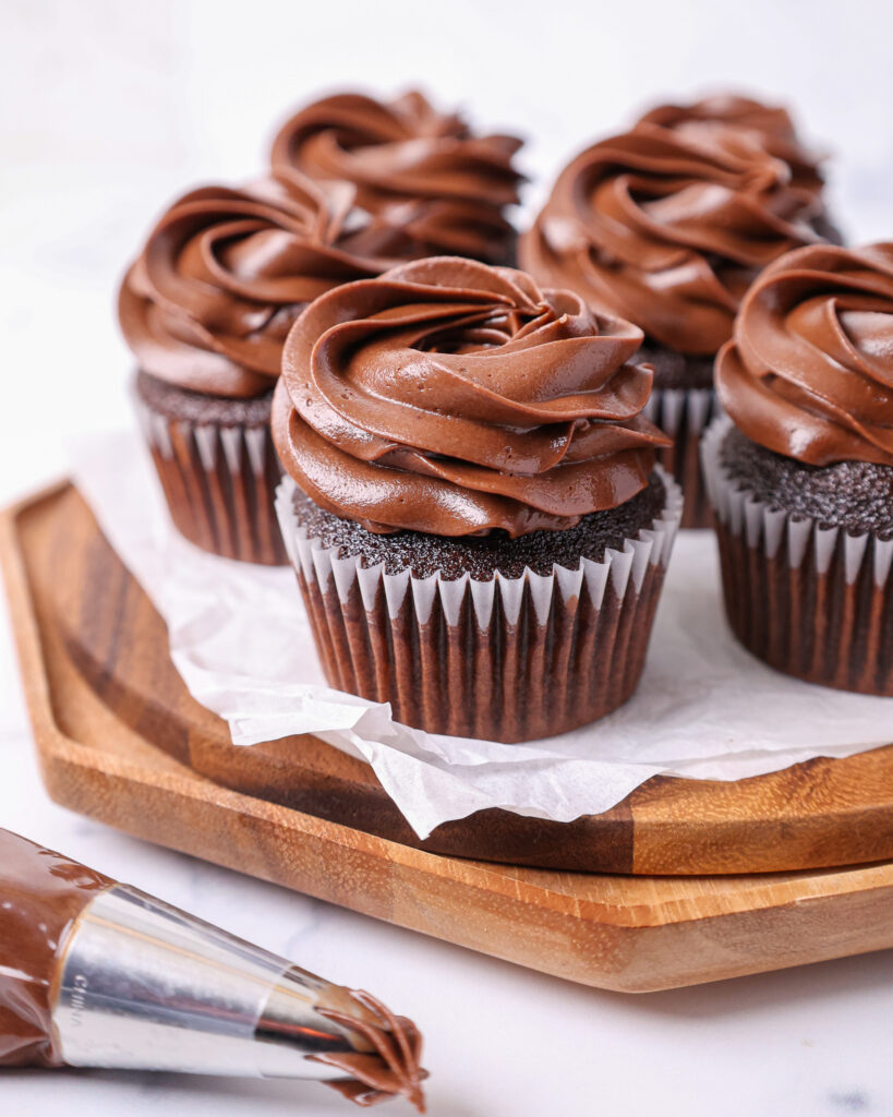 image of moist chocolate cupcakes that have been frosted with a decadent dark chocolate buttercream