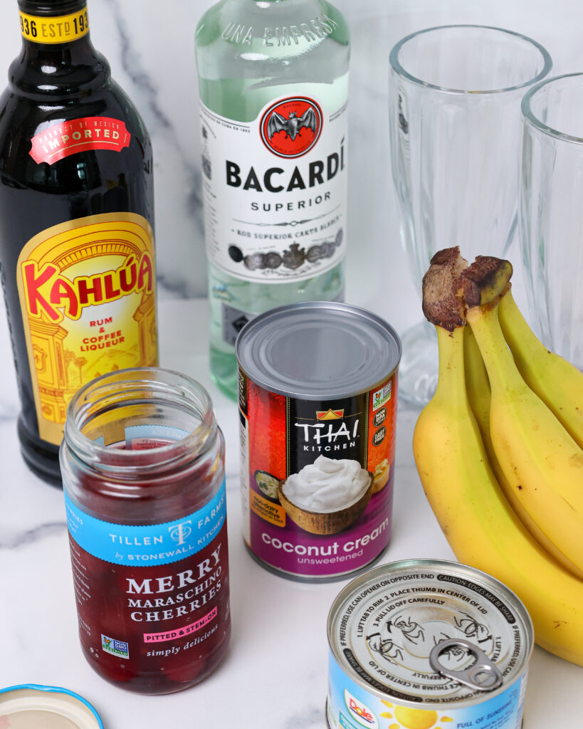 image of ingredients laid out to make a frozen rum cocktail called a dirty monkey