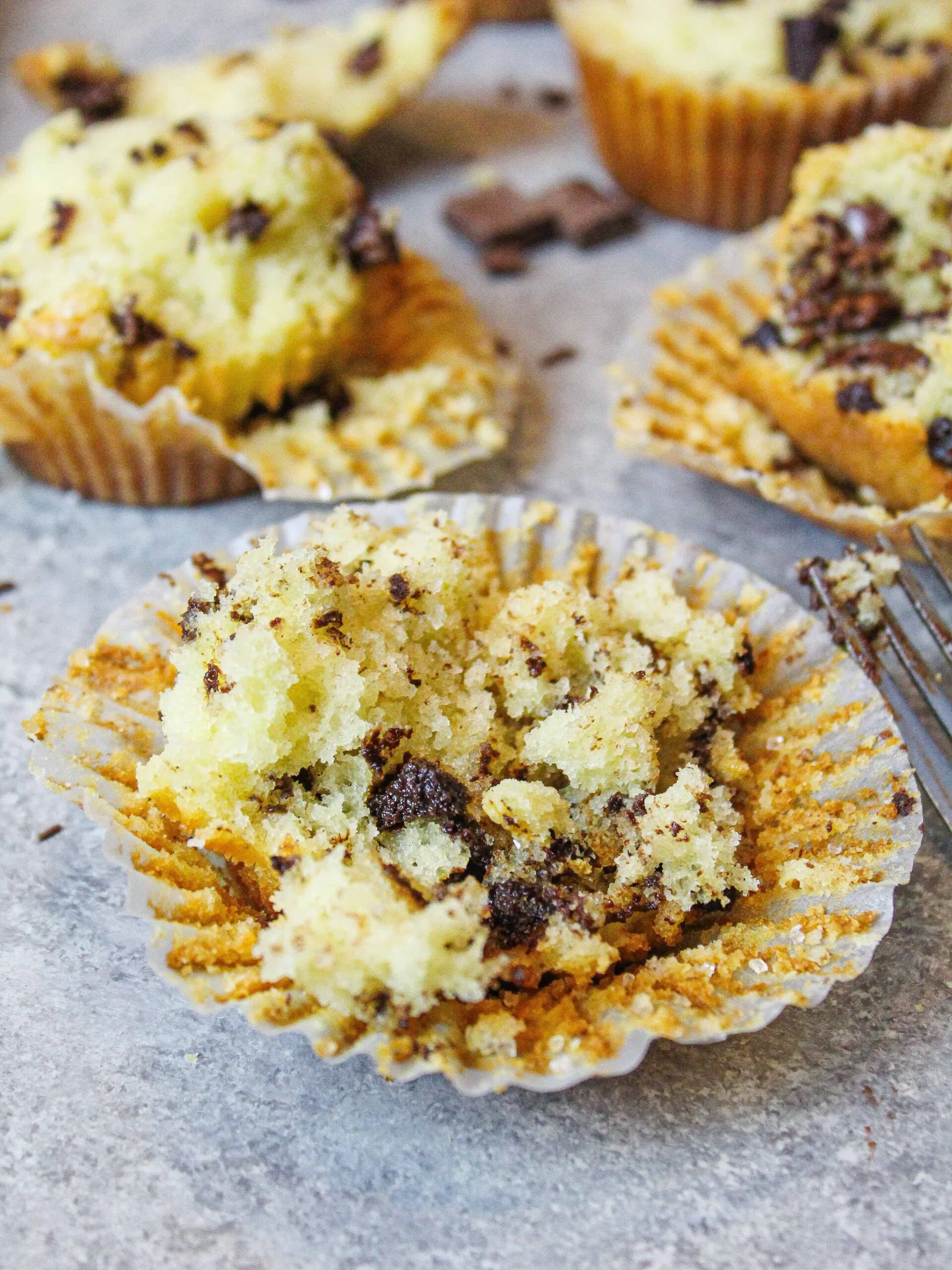 photo of testing the crumb of a batch of chocolate chip muffins while recipe testing