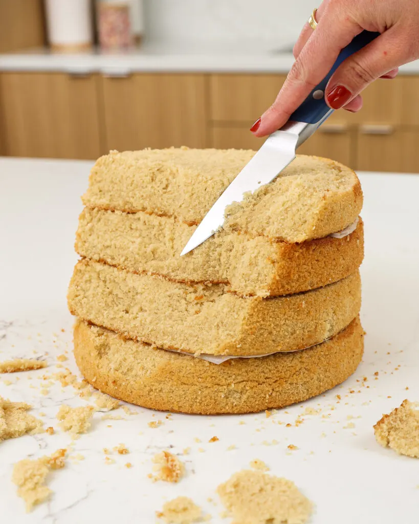 image of tan cake layers being trimmed to make an ocean beach cake with jelly
