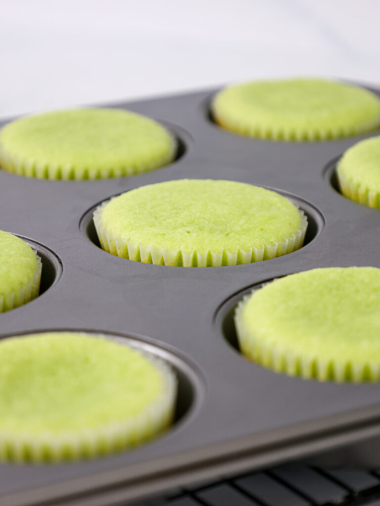 image of lime cupcakes that have been baked and are cooling on a wire rack