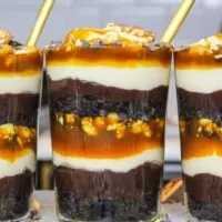 image of snickers trifles made in individual glasses to make them easy to serve and eat